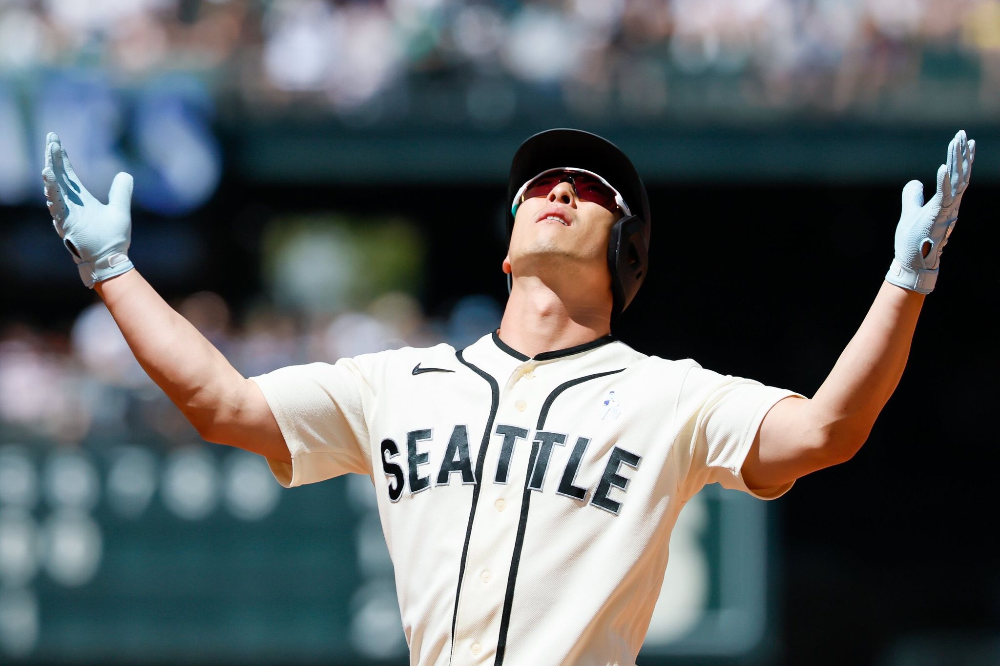 Seattle Mariners designated hitter Rob Refsnyder celebrates on first base after hitting a single during the sixth inning against the Boston Red Sox, June 21, 2026 in Seattle. (Jennifer Buchanan / The Seattle Times)