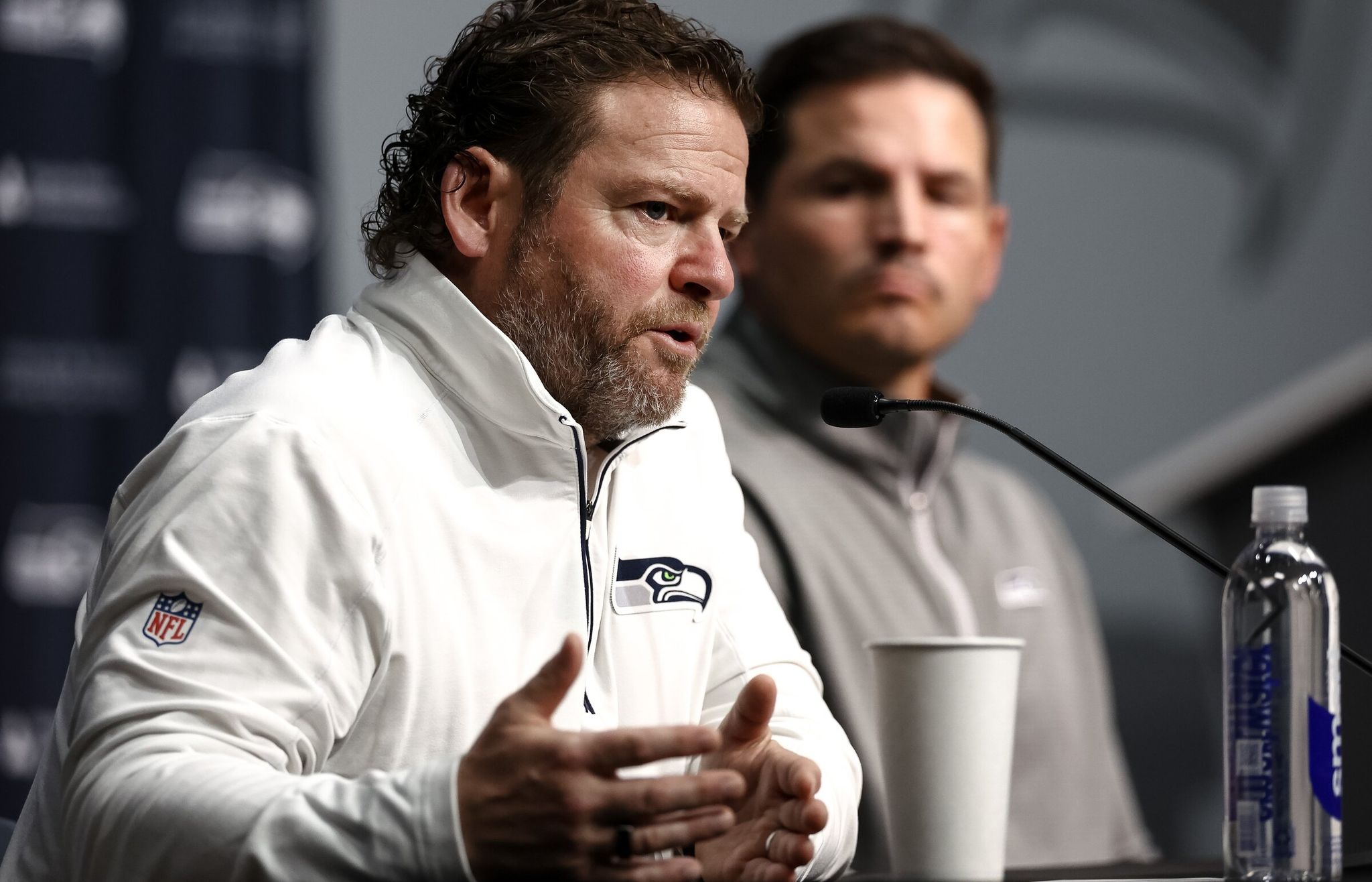Seahawks general manager John Schneider speaks about the upcoming NFL draft with head coach Mike Macdonald at an April press conference. (Nick Wagner / The Seattle Times)