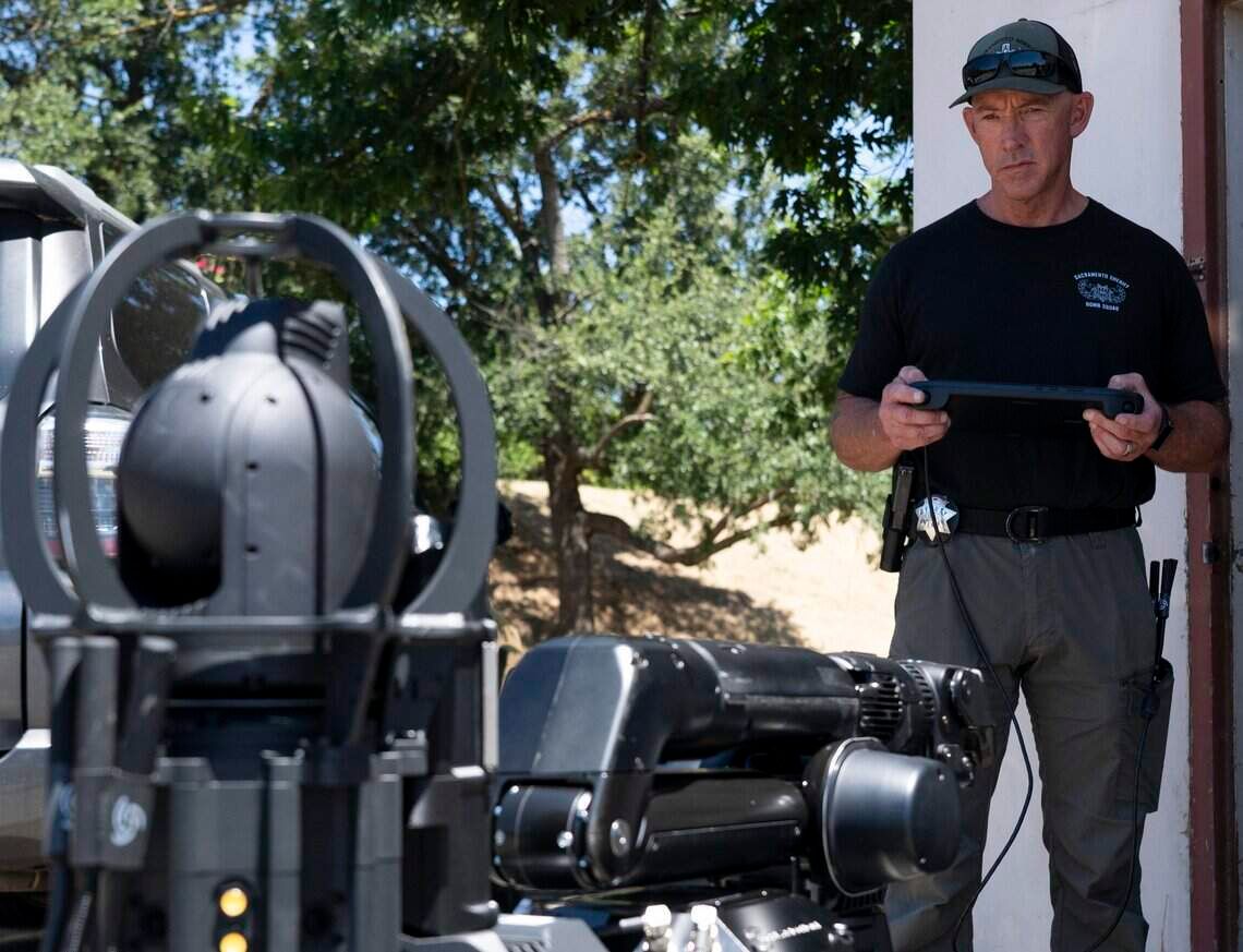 Sacramento County Sheriff’s Lt. Tom McCue demonstrates the office’s new robot canine, Buster. The robot will be operated by the sheriff’s office bomb squad. (HG BIGGS/The Sacramento Bee/TNS)