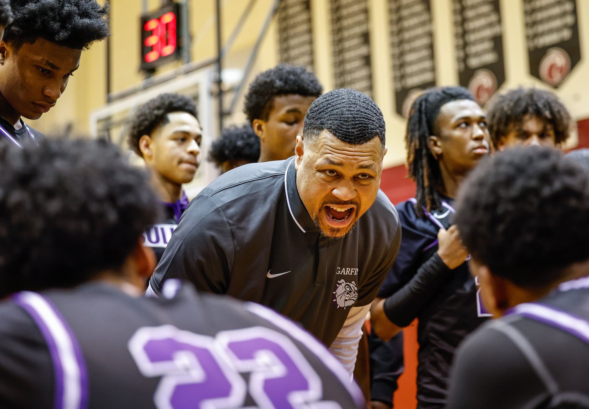 Garfield coach Brandon Roy tries to get his Bulldogs back in the game against Rainier Beach during a timeout in the second half.  The Garfield Bulldog Boys Basketball team played the Rainier Beach Vikings in the Metro League Championship game Friday, Feb. 14, 2025 at Royal Brougham Pavillion, on the campus of Seattle Pacific University. (Dean Rutz / The Seattle Times)
