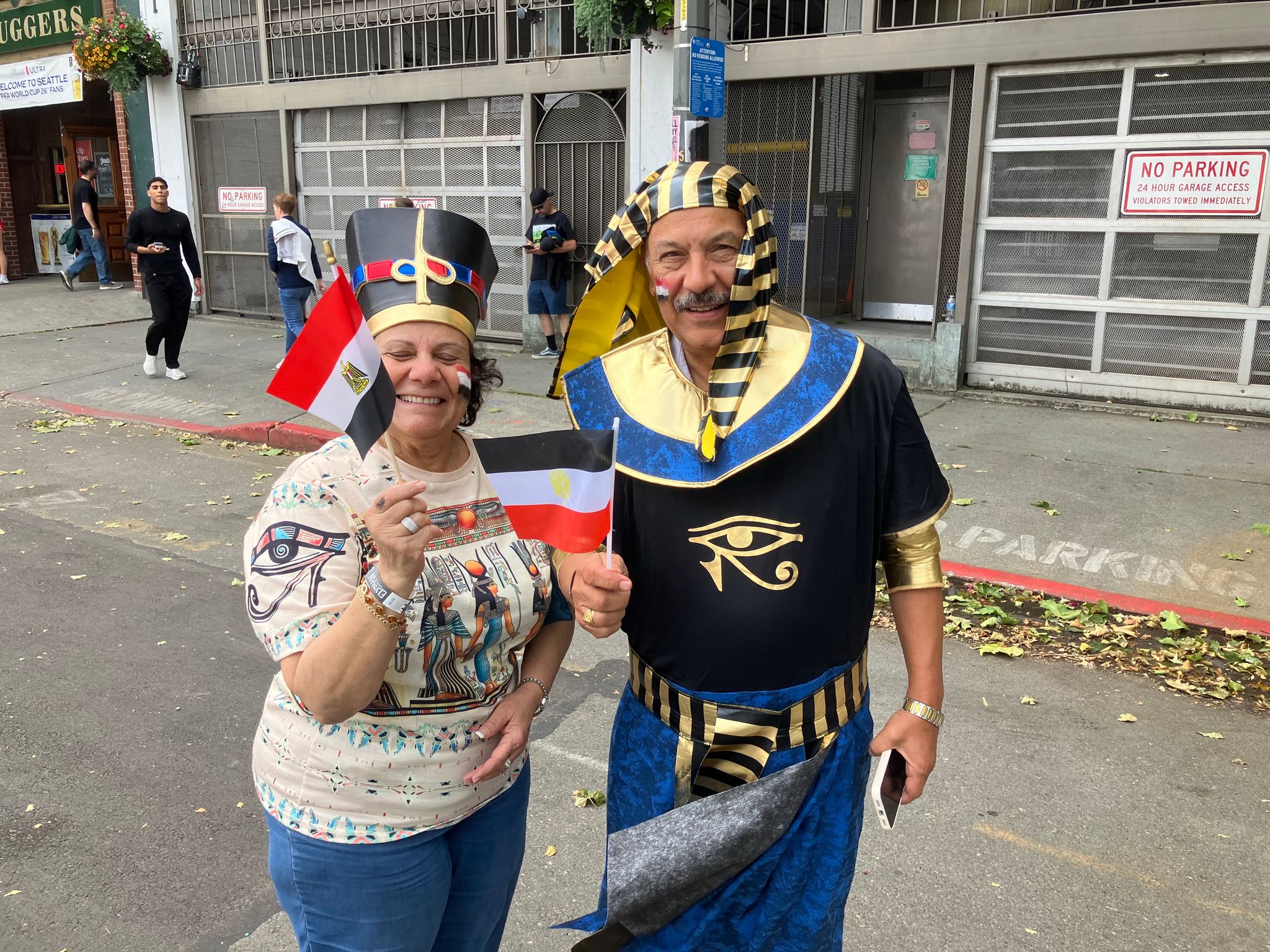 Mary and Joe Youseff — Egyptian immigrants from Portland — in ornate Pharaoh-style costumes made of fans outside Seattle Stadium before the World Cup match on Friday. (Daniel Bikman / The Seattle Times)