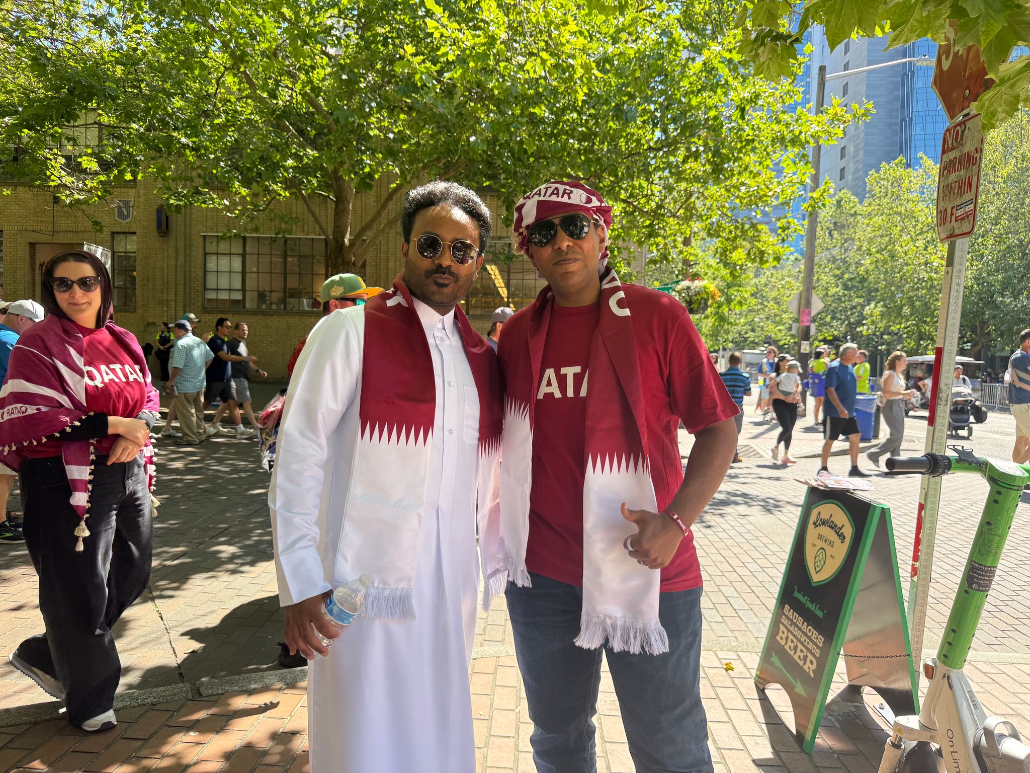 Seattle residents Mohammed Said and Huseyn Aodoaib (left) support Qatar during today’s World Cup match at the stadium in Seattle. (Olivia Petty / The Seattle Times)
