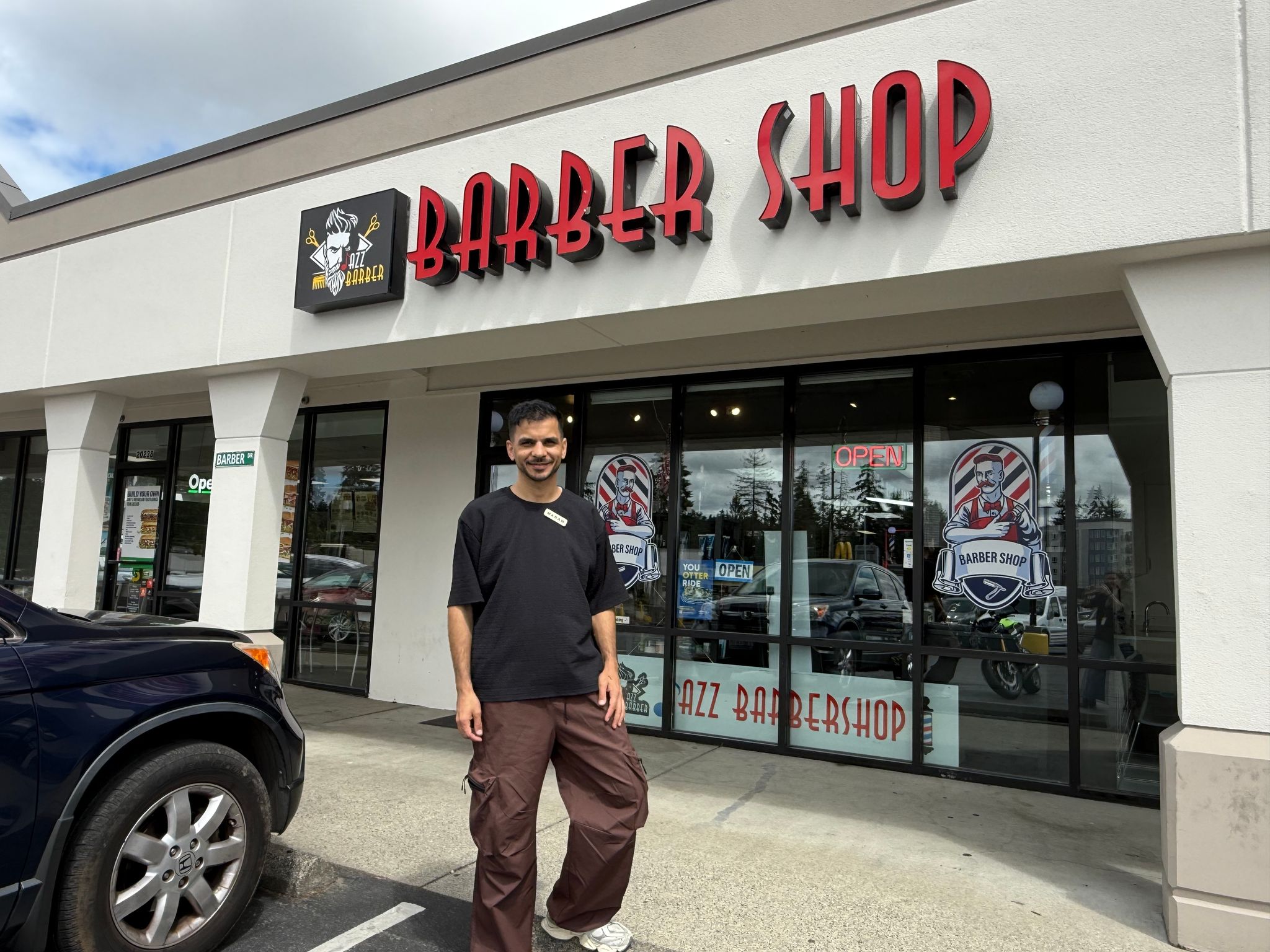 Maram Hammadi at his Jazz Barbershop in Shoreline. Hammadi and his barbers cut the hair of the Egyptian soccer team before its FIFA Men’s World Cup matches in Seattle against Belgium and Iran. (Olivia Petty / The Seattle Times)