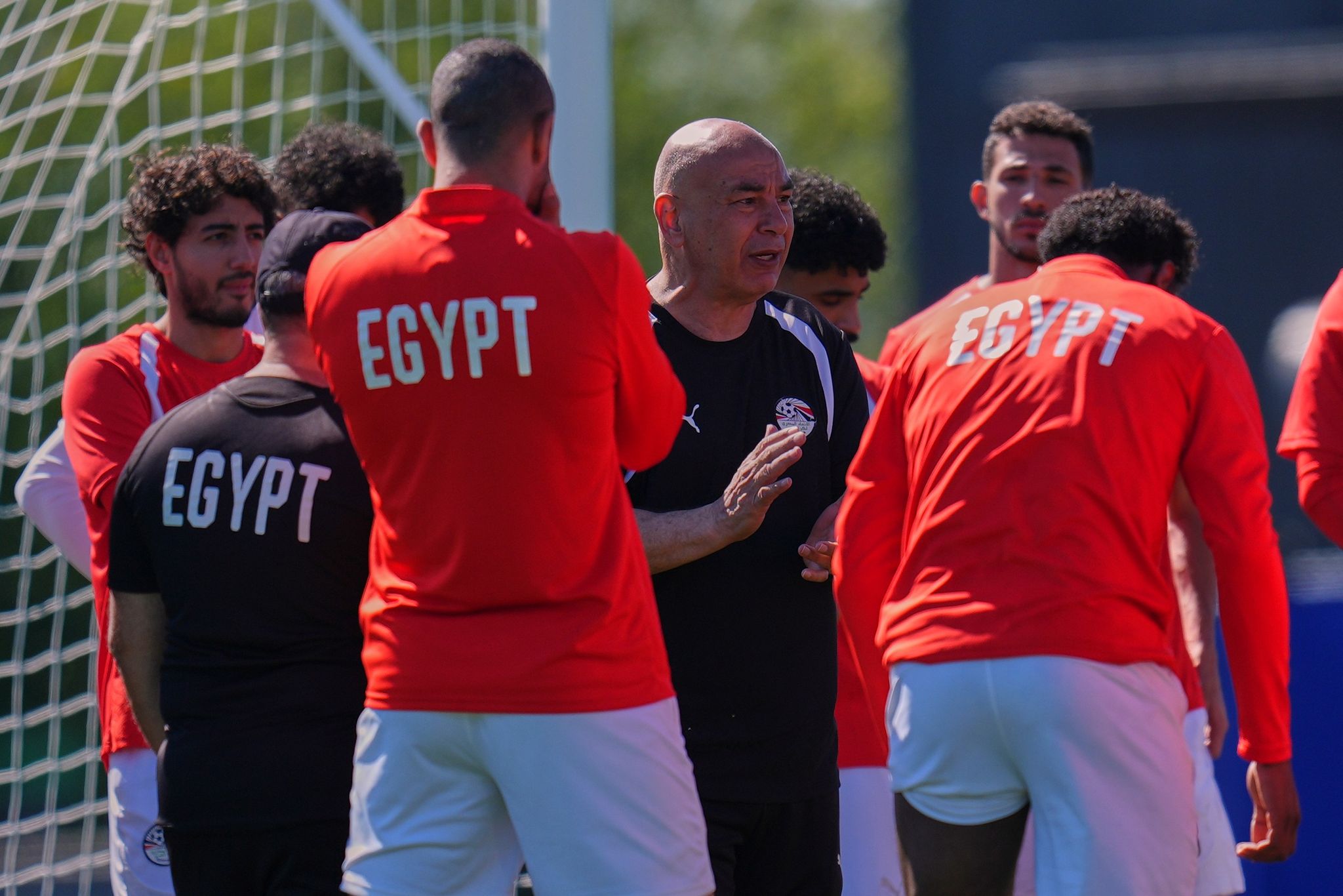 Egypt head coach Hossam Hassan speaks with players during a training session before his team's World Cup Group G match against Belgium in Seattle, Sunday, June 14, 2026. (AP Photo/Manu Fernandez)
