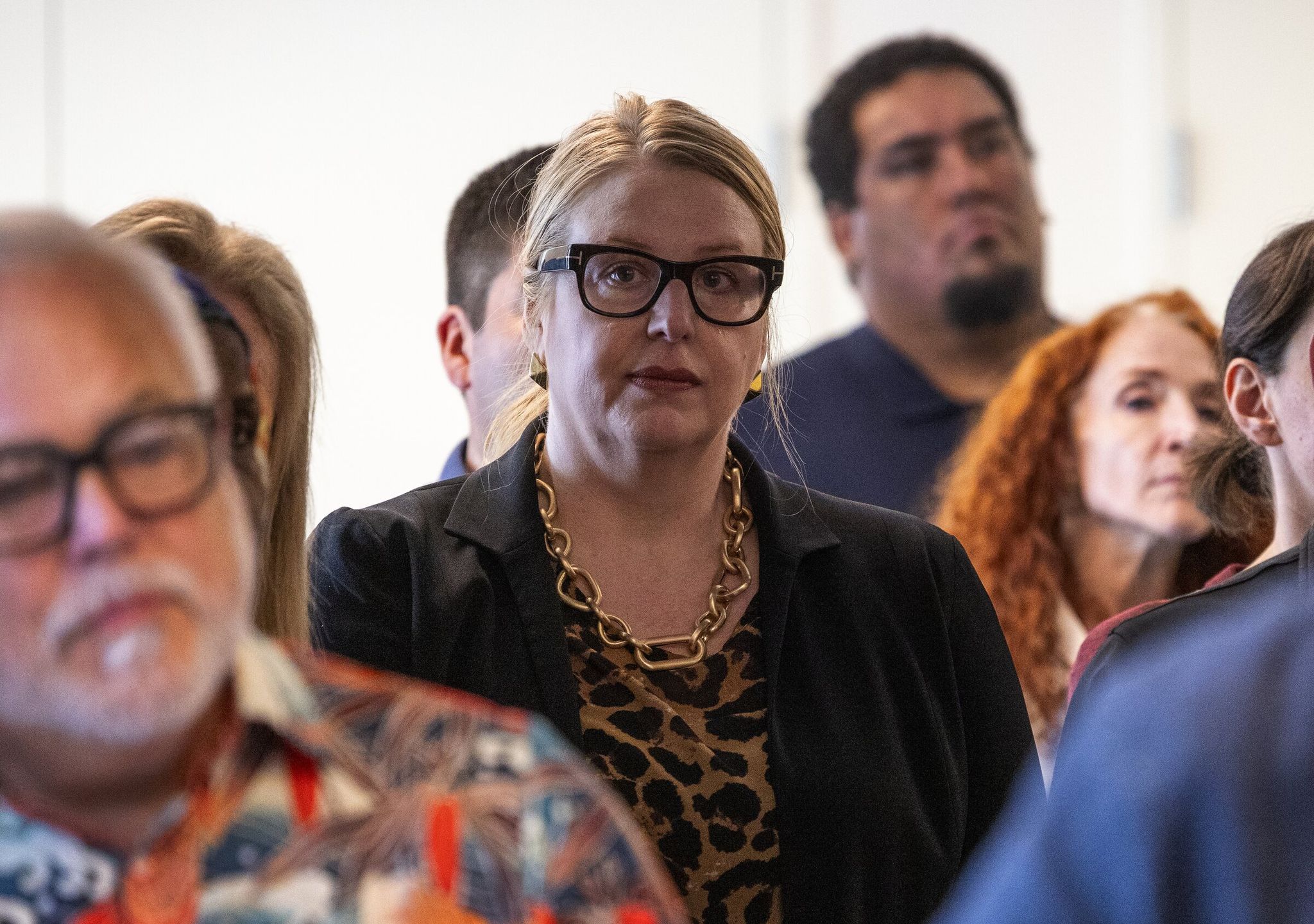 Kelly Kinnison, center, CEO of the King County Regional Homelessness Authority (KCRHA), at a press conference on Wednesday. (Ken Lambert / The Seattle Times)