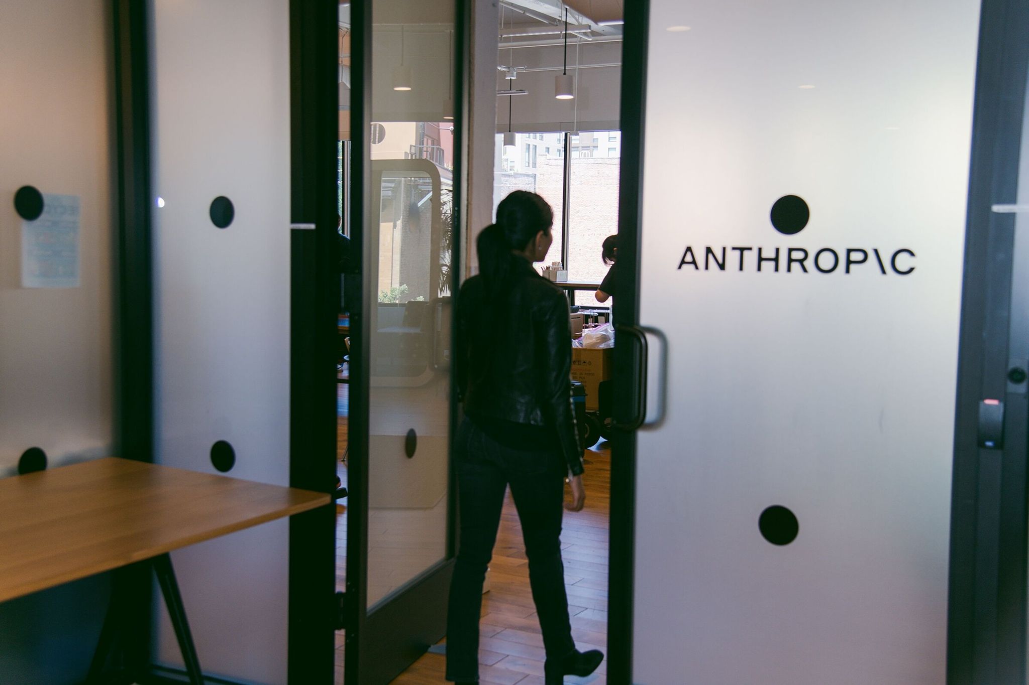 An employee enters the Anthropic office in San Francisco, Calif. Anthropic is expanding its Seattle footprint by finalizing a long-term lease in the South Lake Union neighborhood. (Marissa Leshnov / The New York Times, 2023)