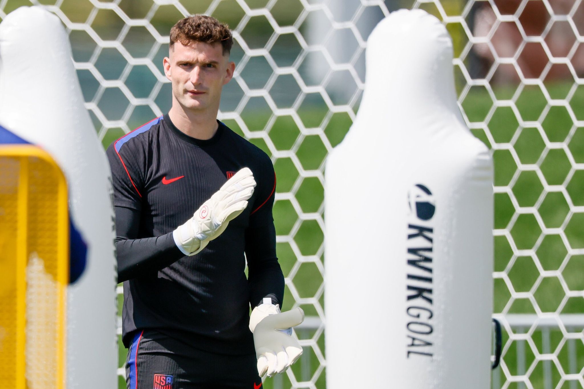 U.S. men’s national team goalkeeper Matt Freese claps his gloves before beginning an exercise during training on Sunday. (Jennifer Buchanan / The Seattle Times)