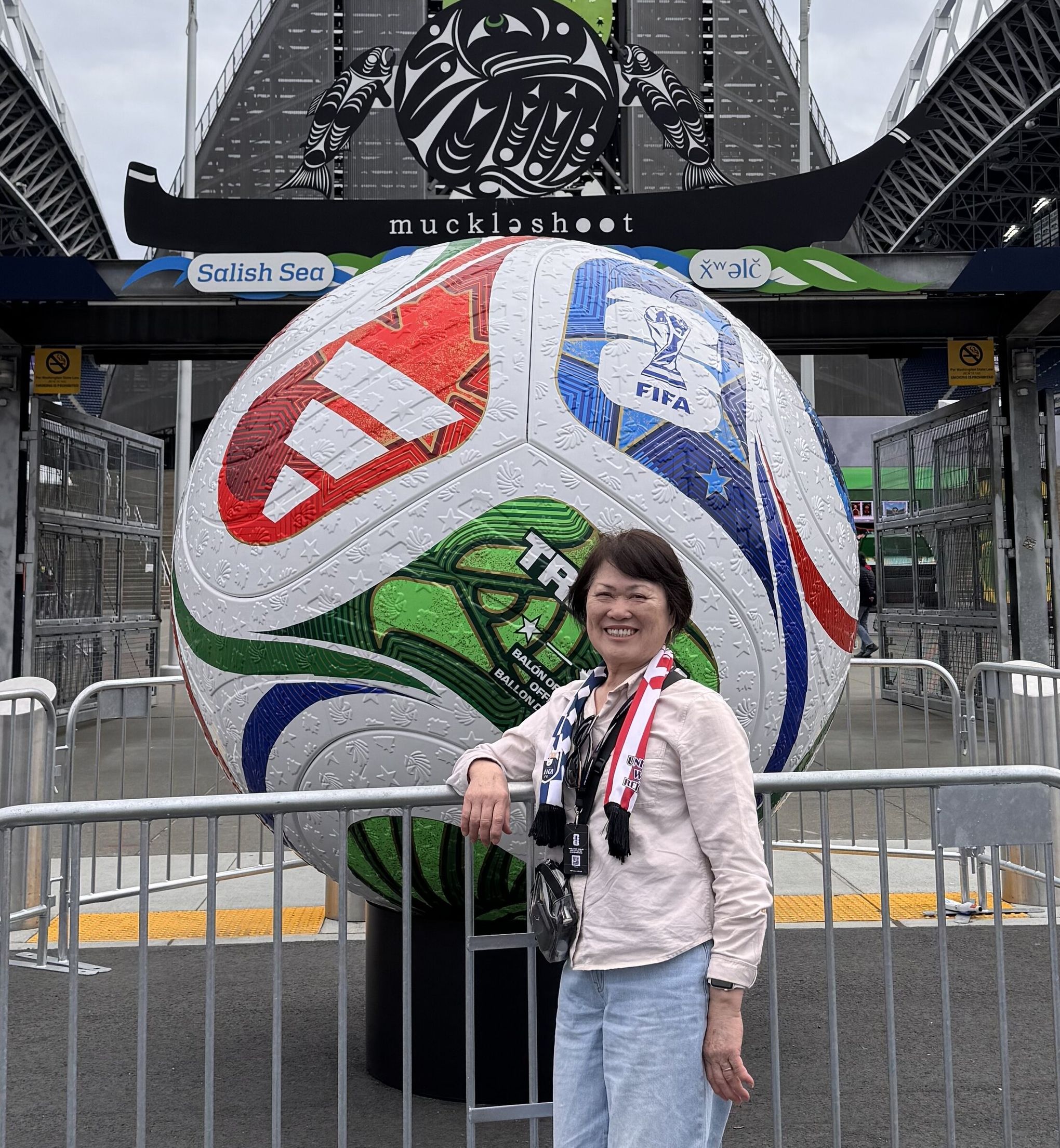 Hen Woon enjoying her day at the Seattle stadium. Hen immigrated from China in 1985. For the last 10 years she has worked seven days a week in the family business—Common Ground Coffee and Cupcakes in Renton. (Provided by Christina Woon)