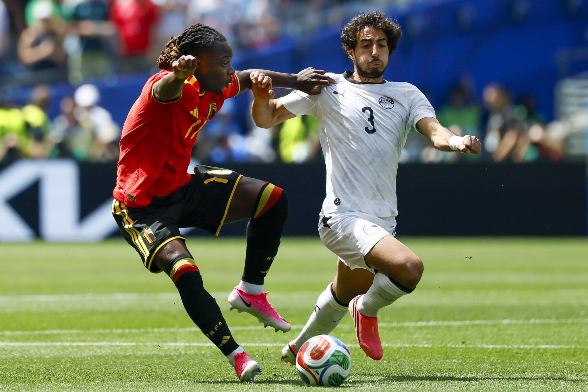 Belgium midfielder Jeremy Doku is tackled hard by Egypt defender Mohamed Hany during their World Cup match last month. (Jennifer Buchanan / The Seattle Times)