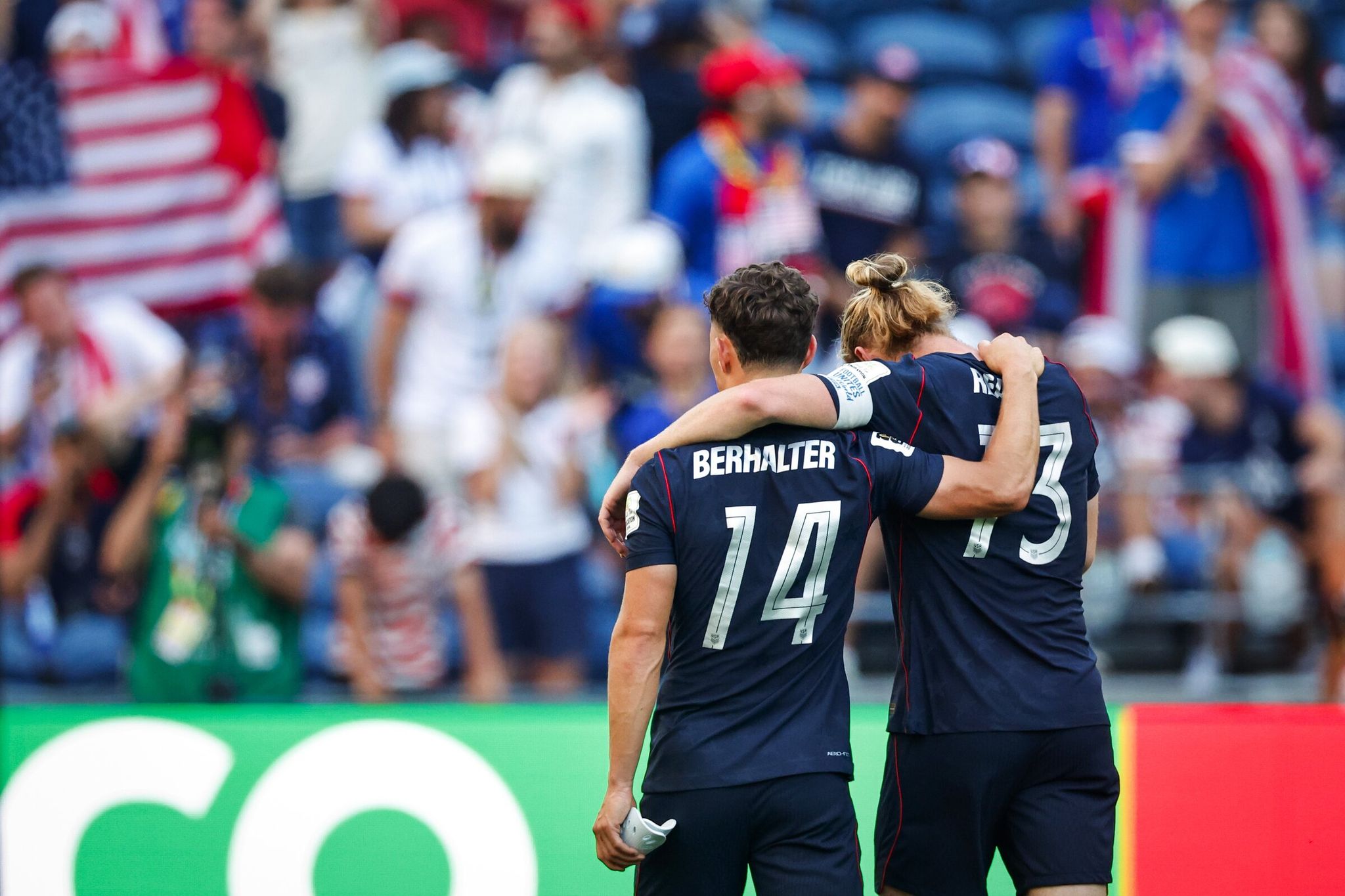 US national team midfielder Sebastian Berhalter and defender Tim Ream leave the field after a 4–1 defeat to Belgium in the World Cup Round of 16 match on Monday at a stadium in Seattle. (Dean Rutz / The Seattle Times)
