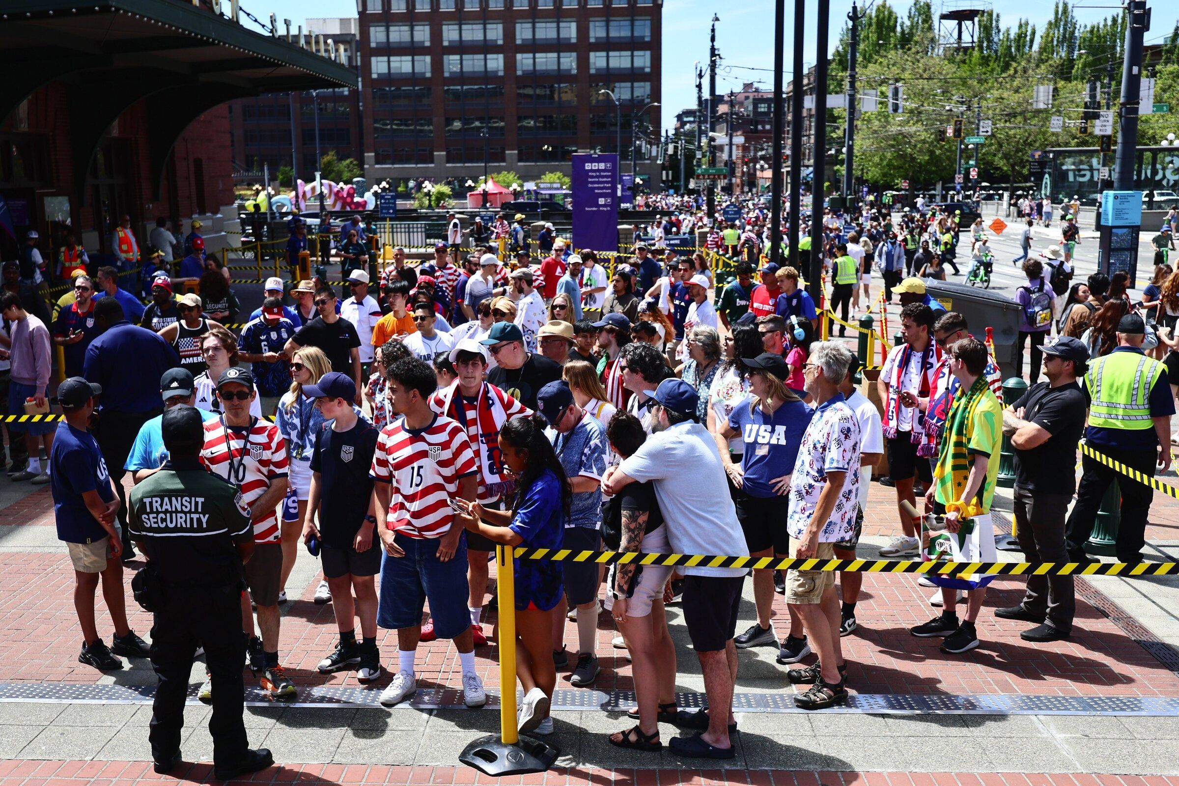 Soccer fans lined up at the International District/Chinatown station after the World Cup match between the U.S. and Australia on June 19. The Seattle Mariners played an evening game that same day. (Kevin Clark / The Seattle Times)
