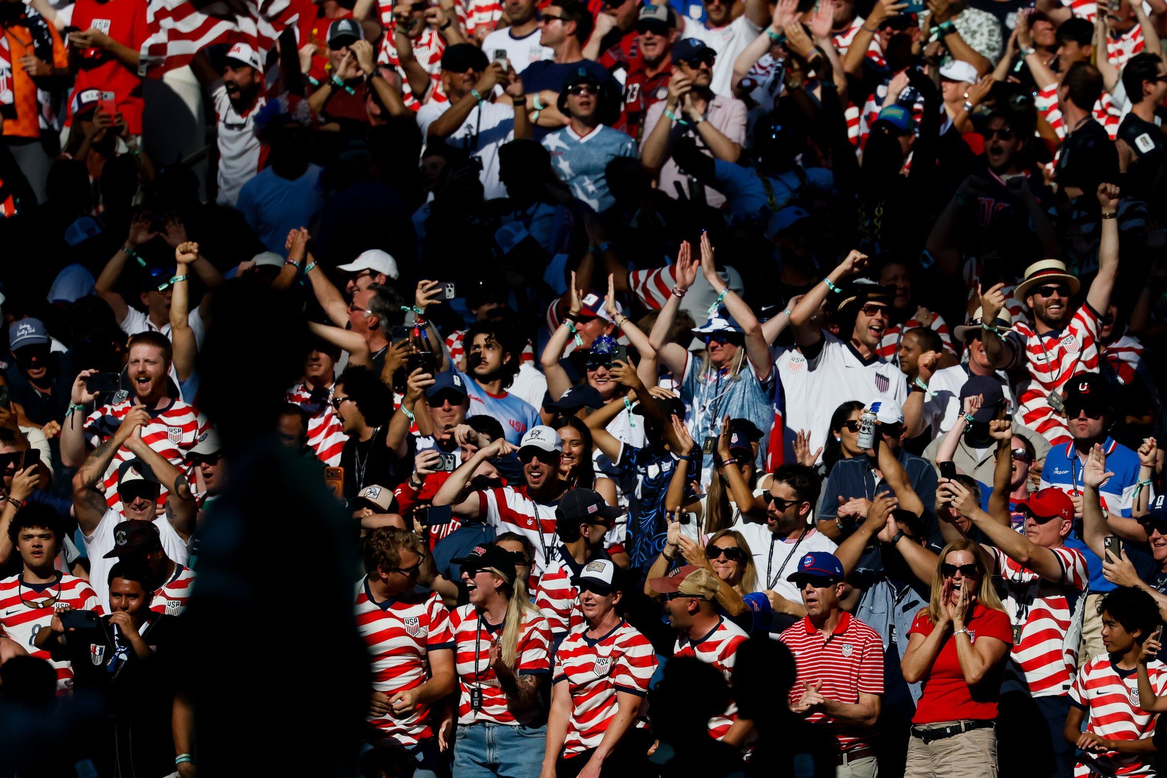 Fans celebrate a goal by midfielder Mallik Tillman of the United States during a World Cup match in Seattle on July 6, 2026. (Jennifer Buchanan / The Seattle Times)