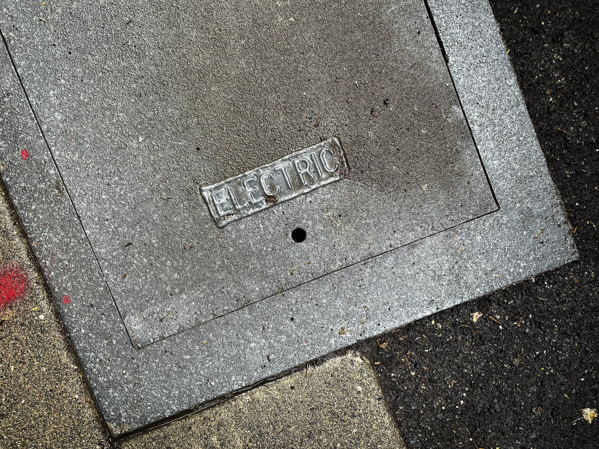 An electrical access point sits in the middle of an Anne-style sidewalk. (Ken Lambert / The Seattle Times)