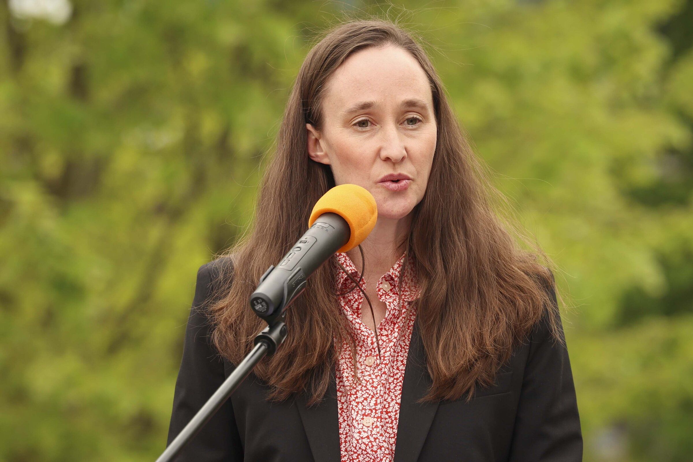 Seattle Mayor Katie Wilson announces her tax collection plan for the Families, Education, Preschool Education, and Promise programs at Yezler Terrace Park in Seattle in April. (Ivy Seballo / The Seattle Times)