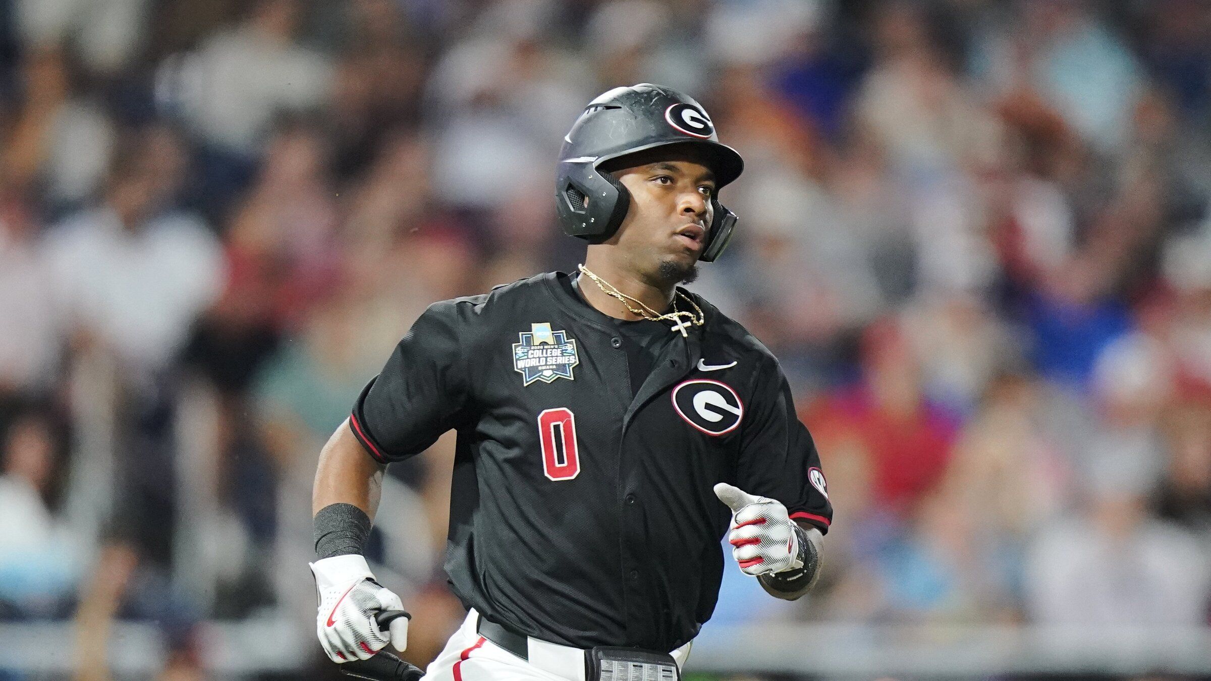 Georgia second baseman Ryan Wynn sprints to first base during an NCAA baseball College World Series game against Texas, June 13, 2026 in Omaha, Nebraska. The Seattle Mariners selected Wynn in the seventh round of the 2026 MLB draft. (Verra Nieuwenhays / Associated Press)
