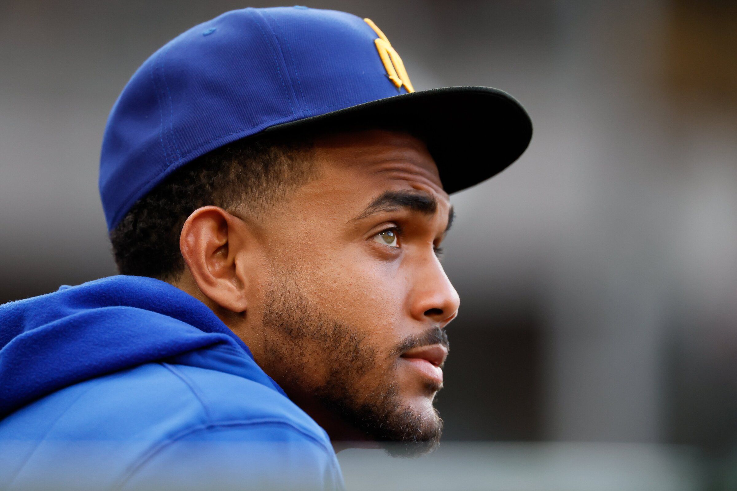 Julio Rodriguez watches from the dugout during the second inning Friday, July 17, 2026 in Seattle. (Jennifer Buchanan / The Seattle Times)