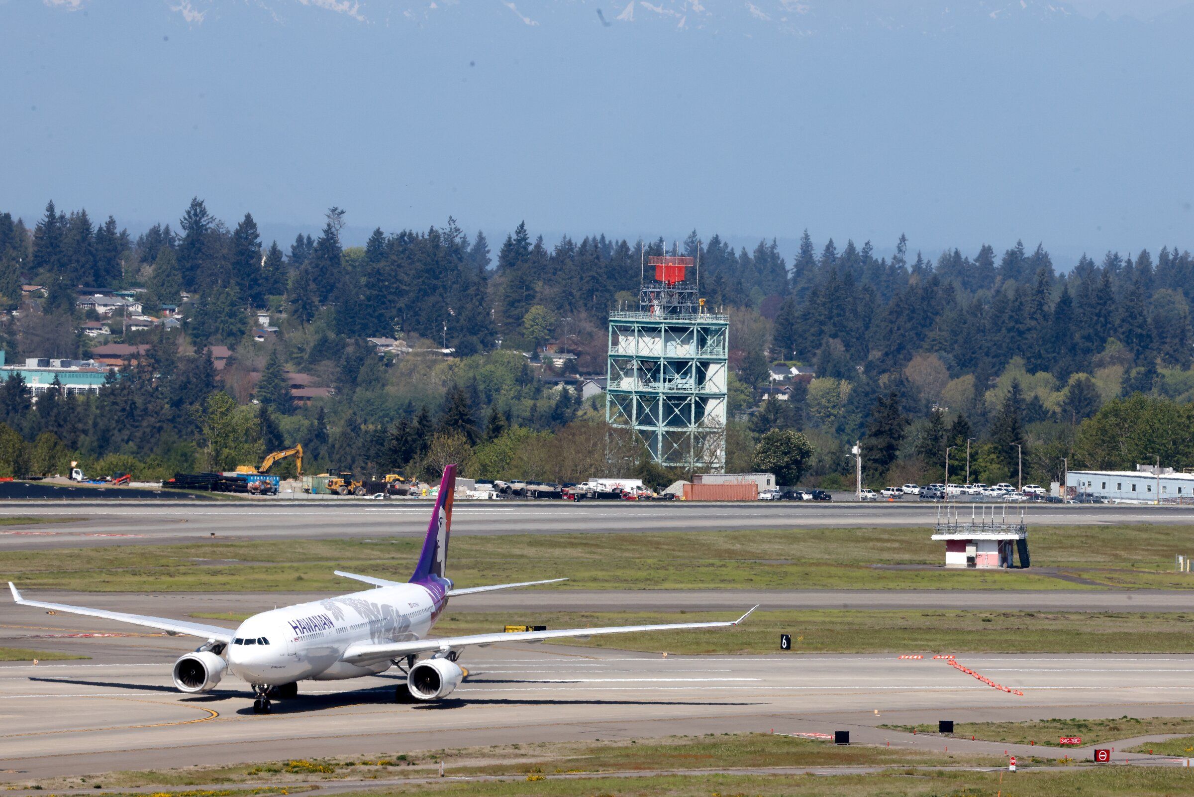 A Hawaiian Airlines aircraft taxiing along a runway at Seattle–Tacoma International Airport in April. (Karen Ducey / The Seattle Times)