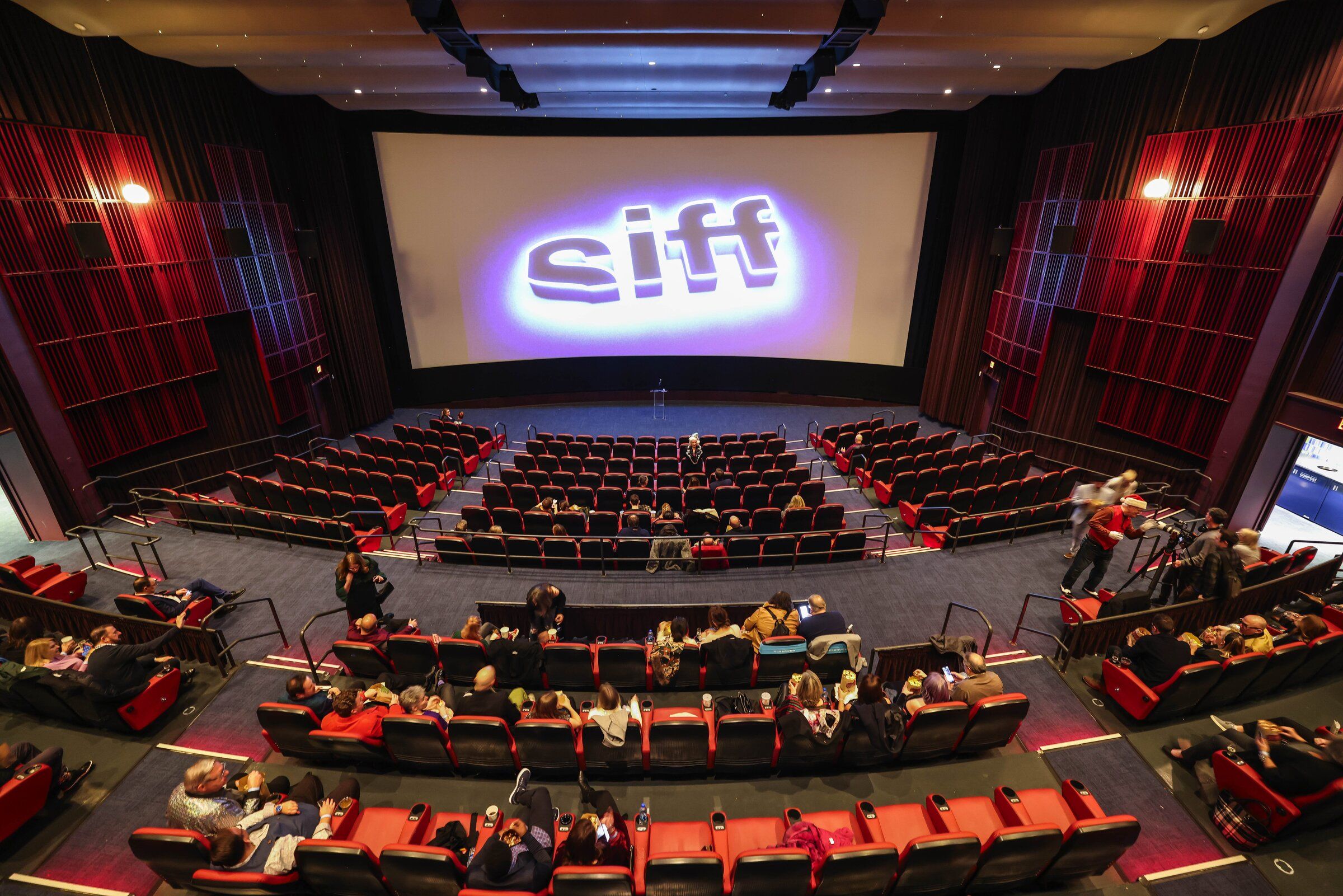 Moviegoers arrive for a film at SIFF Cinema Downtown in 2023. (Dean Rutz / The Seattle Times)