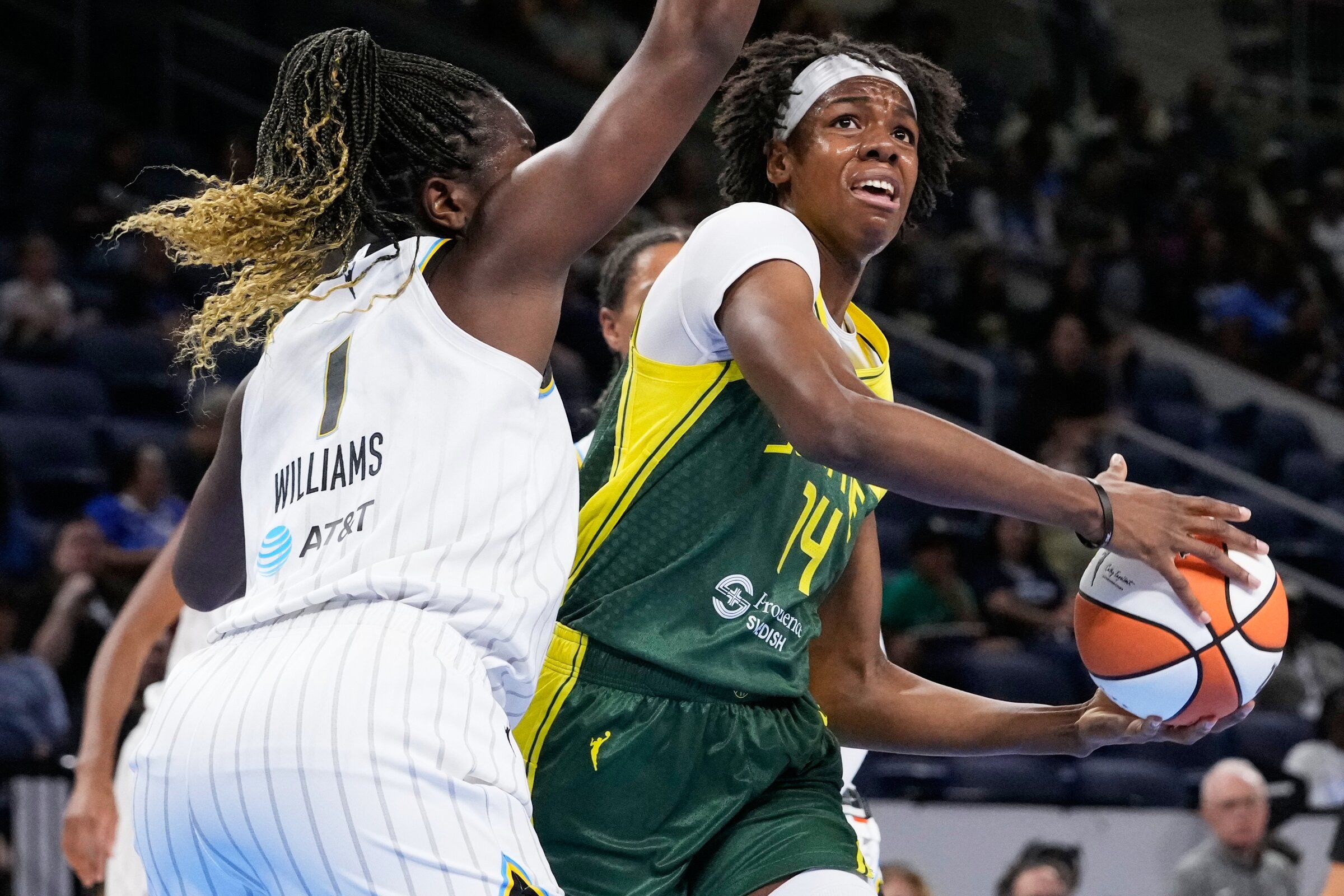 Seattle Storm center Dominique Malonga, right, drives to the basket against Chicago Sky center-forward Elizabeth Williams during the first half of a WNBA basketball game Wednesday, July 15, 2026, in Chicago. (AP Photo/Nam Y. Huh)