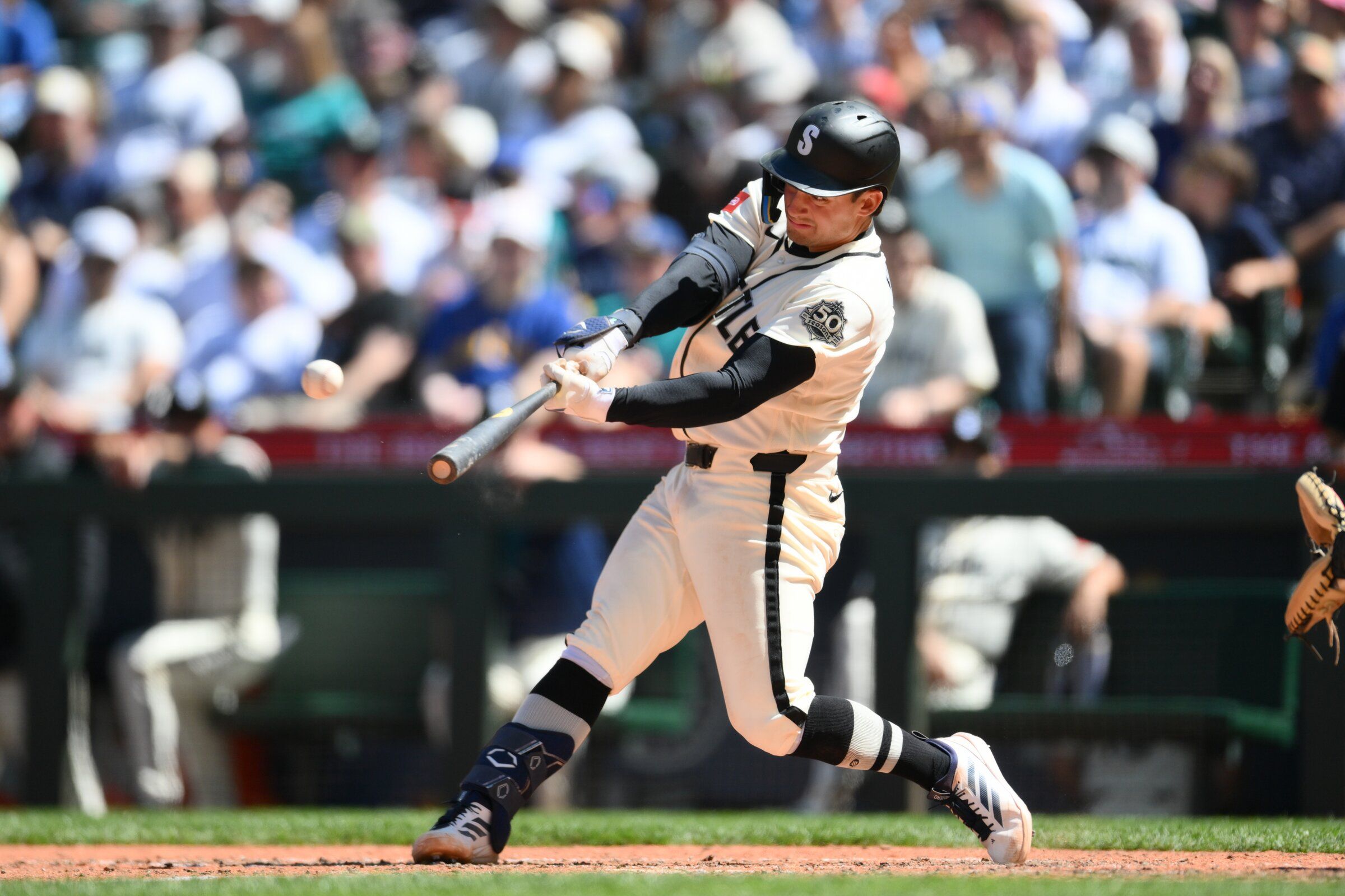 Mariners second baseman Cole Young hits a two-run home run against the Giants during the seventh inning on Sunday at T-Mobile Park in Seattle. (Steven Bisig / IMAGN IMAGES via Reuters Connect)