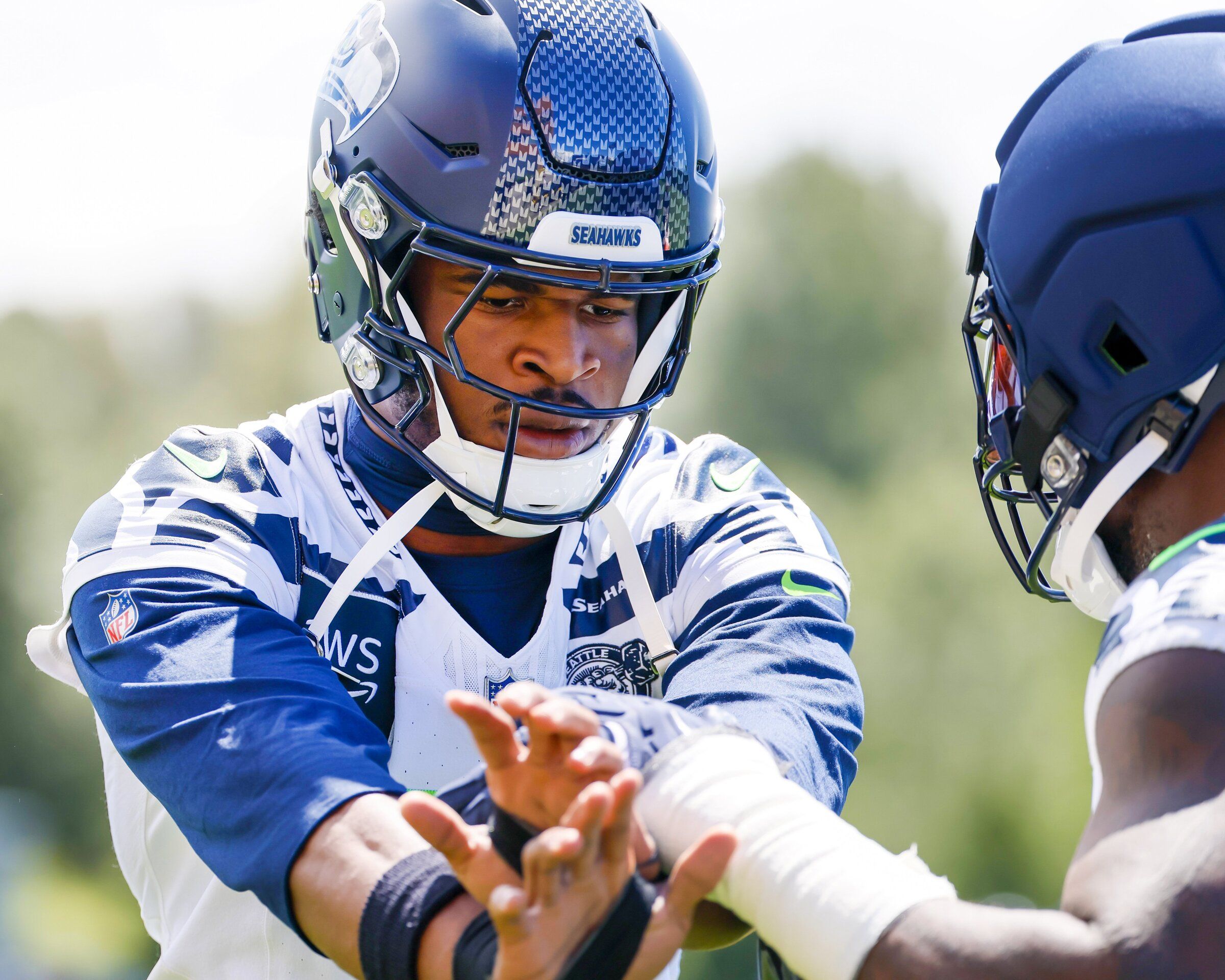 Seattle Seahawks safety Nick Emmanwori goes through drills with defensive end DeMarcus Lawrence during the first day of mini-camp last month. (Jennifer Buchanan / The Seattle Times)
