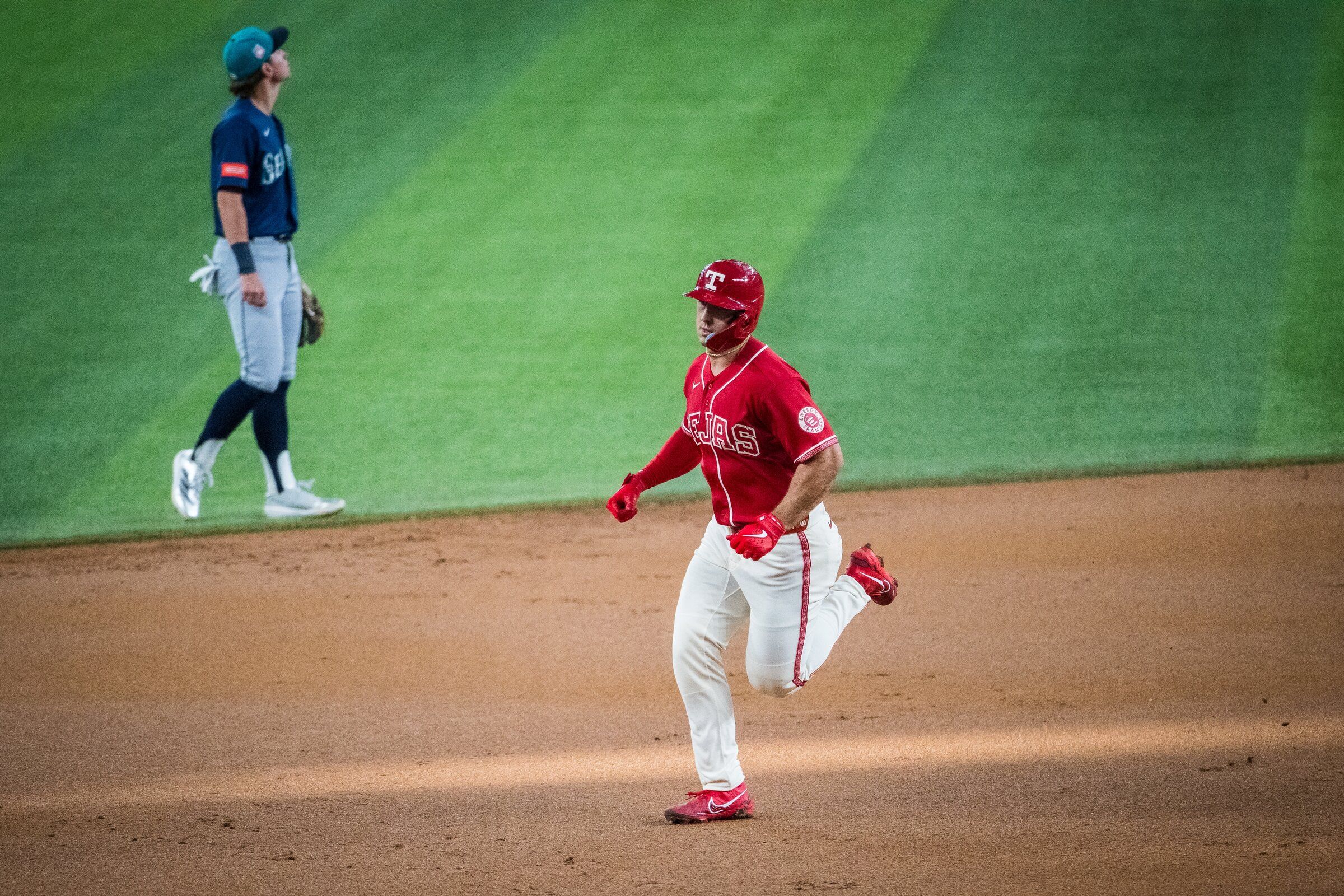 Texas Rangers’ Wyatt Langford (36) rounds the bases after hitting a home run during the first inning of a baseball game against the Seattle Mariners, Friday, July 24, 2026, Arlington, Texas. (Jessica Tobias / AP Photo/Jessica Tobias)