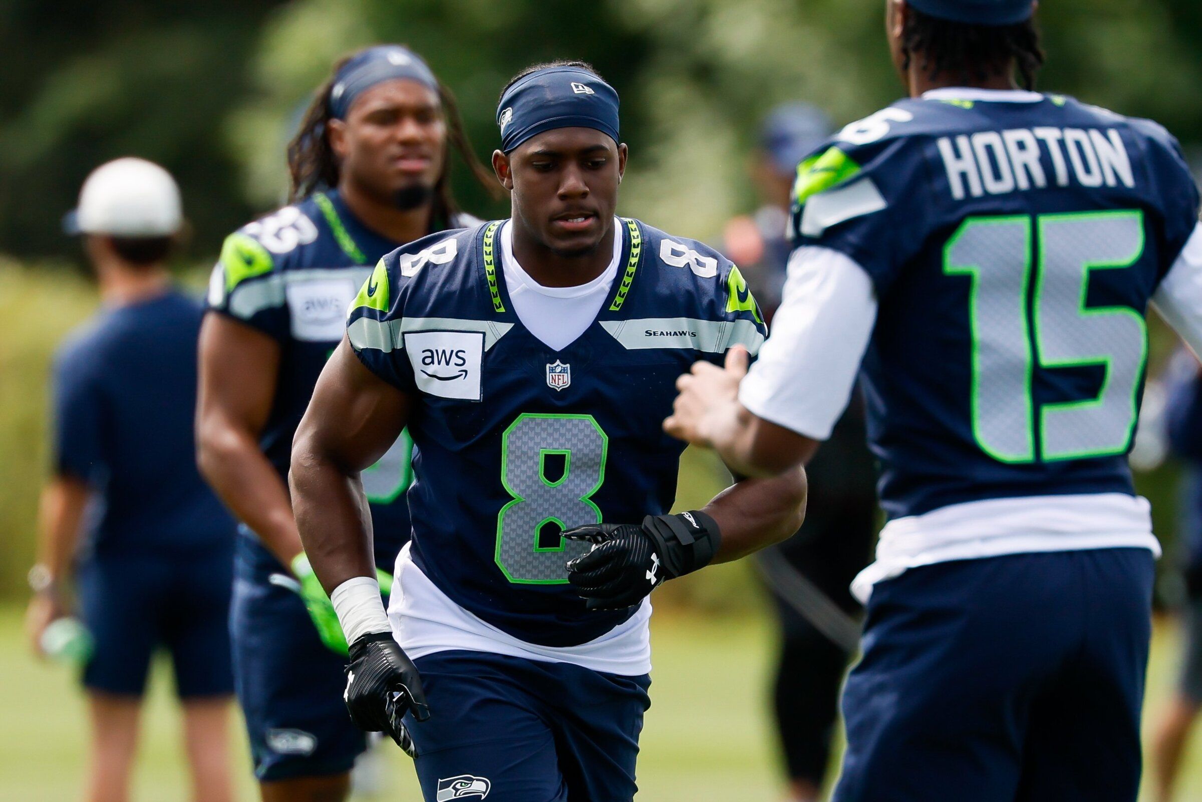 Seahawks running back Jadarian Price runs during the first day of training camp Saturday. (Jennifer Buchanan / The Seattle Times)
