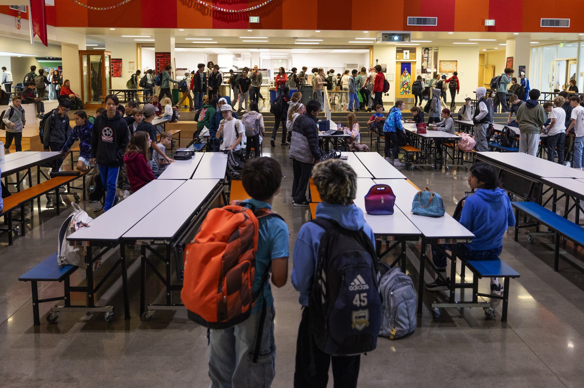 Students at Robert Eagle Staff Middle School socialize during lunch. The Seattle City Council on Tuesday unanimously approved nearly $5 million for universal free meals at Seattle Public Schools, along with $4 million for a new food assistance program. (Ken Lambert / The Seattle Times, 2024)