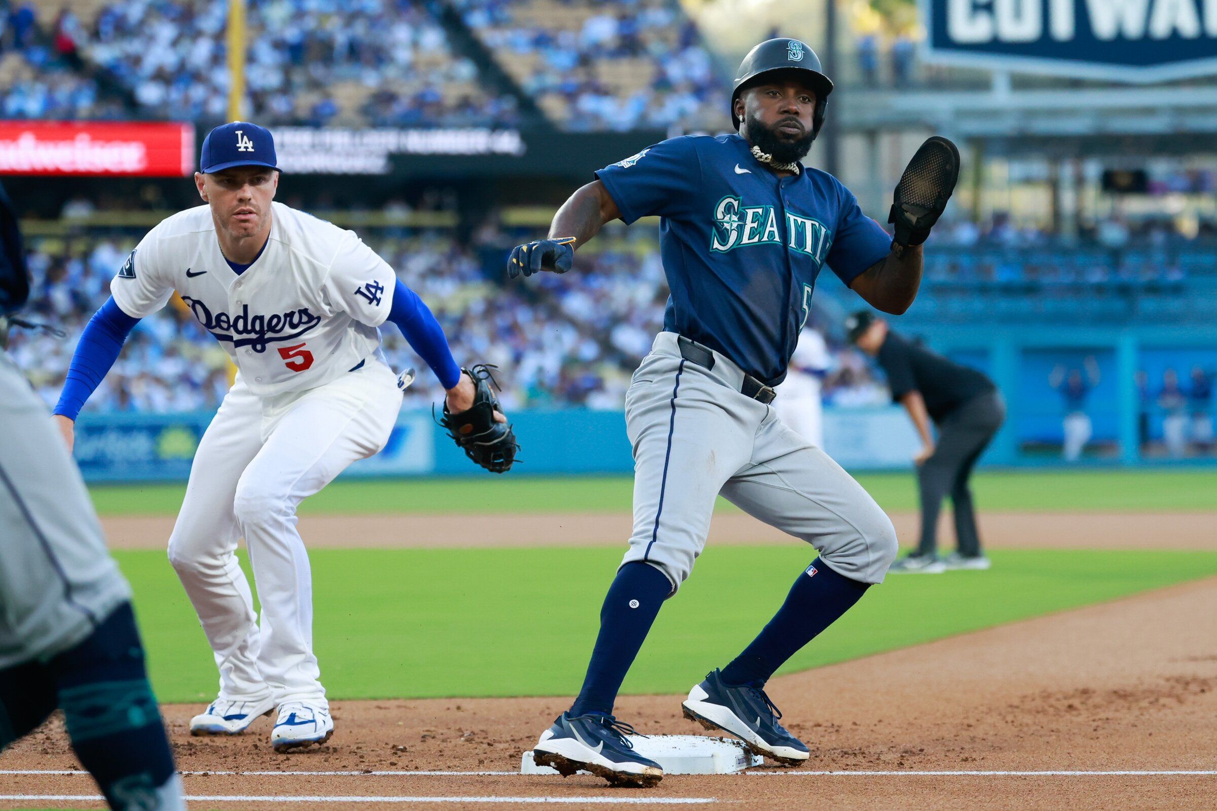 Mariners baserunner Randy Arozarena marks first after a pitching error by Dodgers rookie Roky Sasaki, who is not pictured, in the first inning Thursday in Los Angeles. (William Navarro / Imagn Images via Reuters)