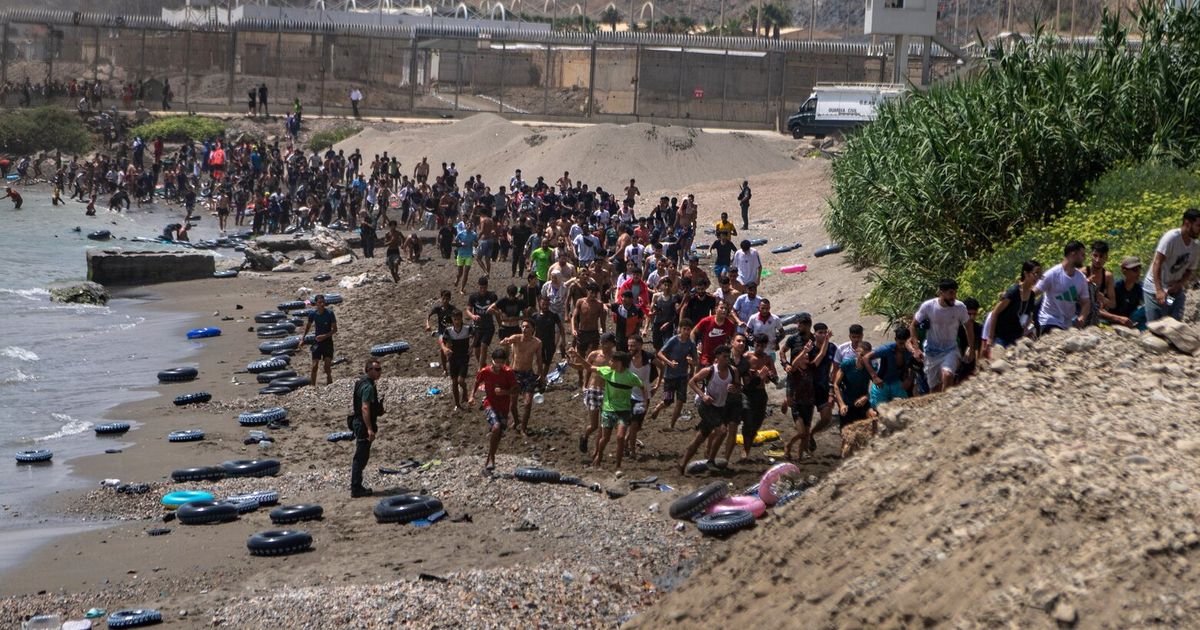Spain deploys military to Ceuta after thousands of people breach Morocco's border and at least 9 die | The Seattle Times