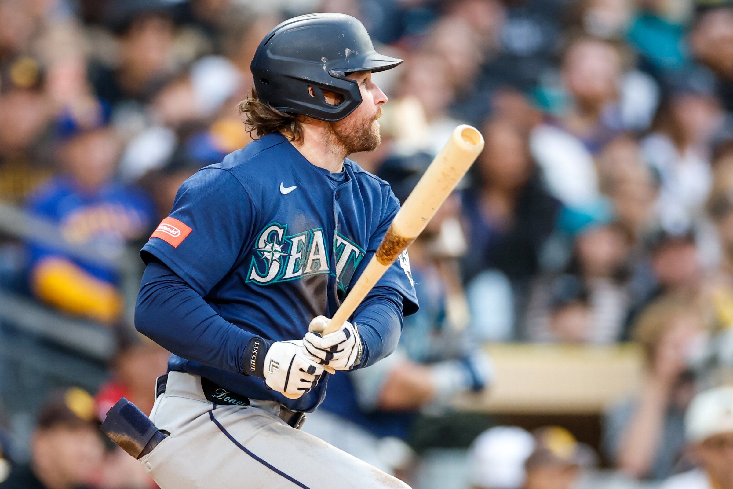 Brendan Donovan of the Seattle Mariners follows through on a successful single in the fourth inning against the San Diego Padres, April 16, 2026, in San Diego. (David Frerker / Imagn Images via Reuters)
