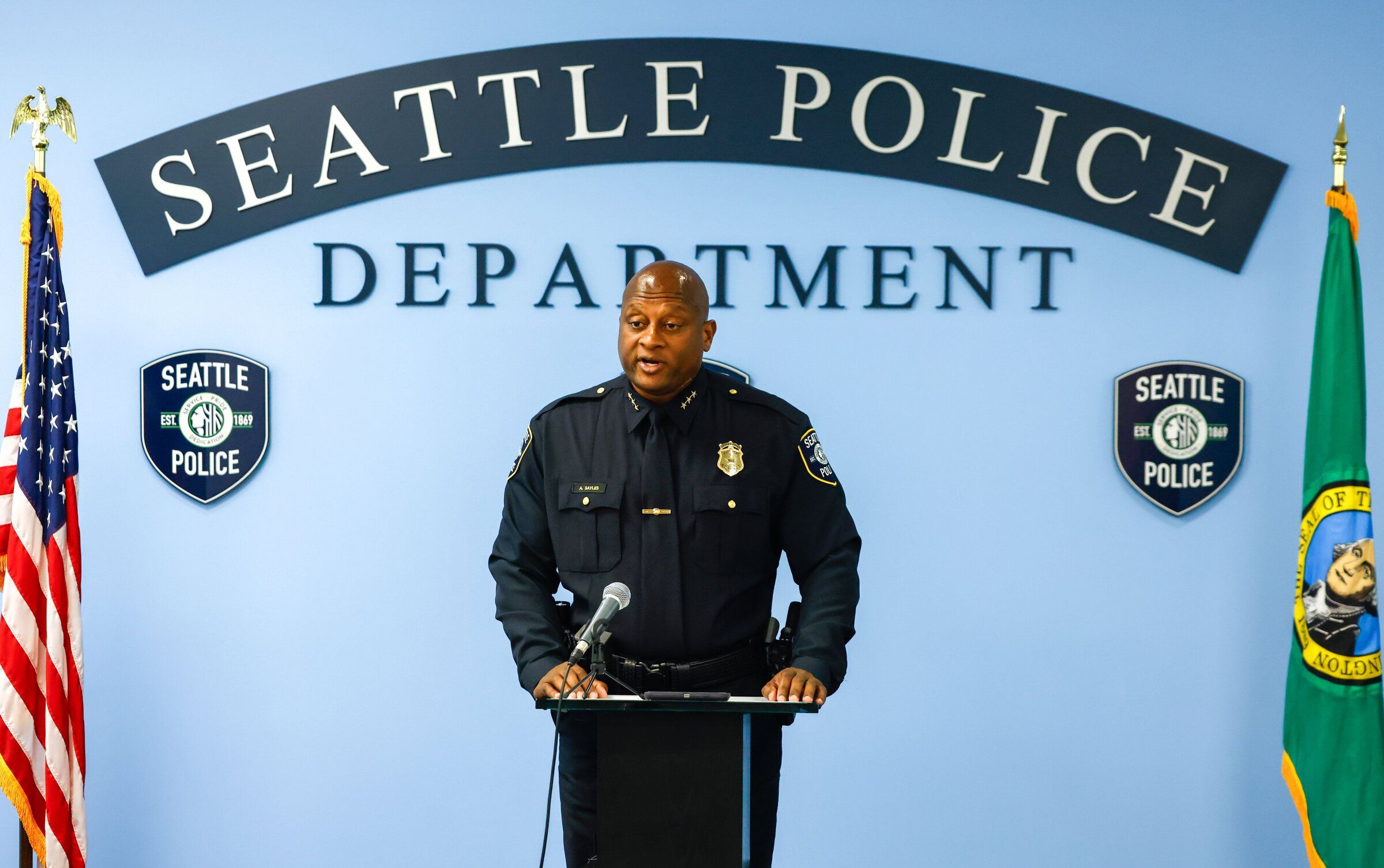 Andre Sayles speaks at a news briefing on the results of “Operation Red Card” at the Seattle Police Department headquarters July 21. (Andrew Burke-Stevenson / The Seattle Times)
