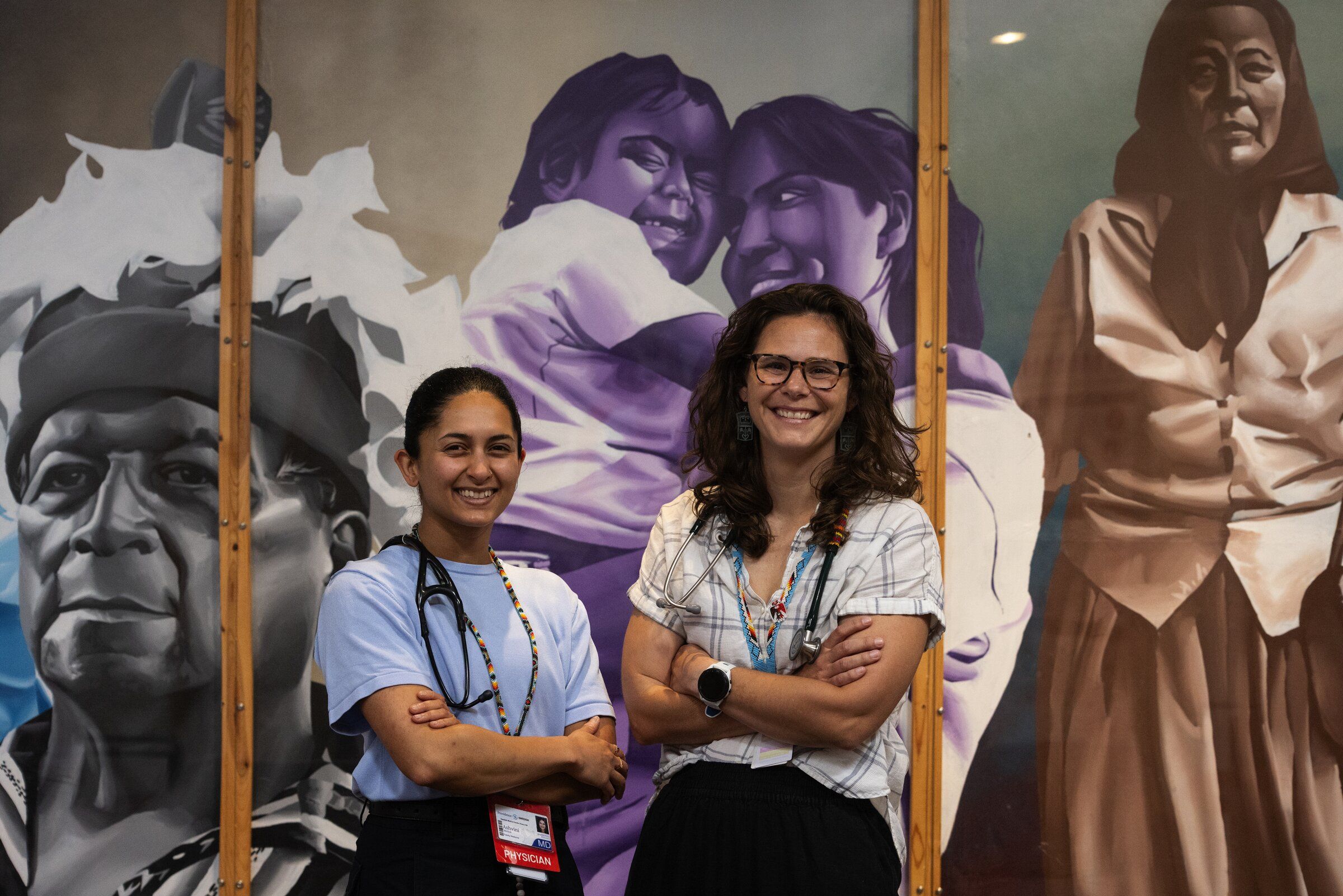 Dr. Ashwini Vaidhya, left, a Providence Swedish resident working at Seattle Indian Health Board, with SIHB chief physician Dr. Elizabeth Parkes. (Ken Lambert / The Seattle Times)
