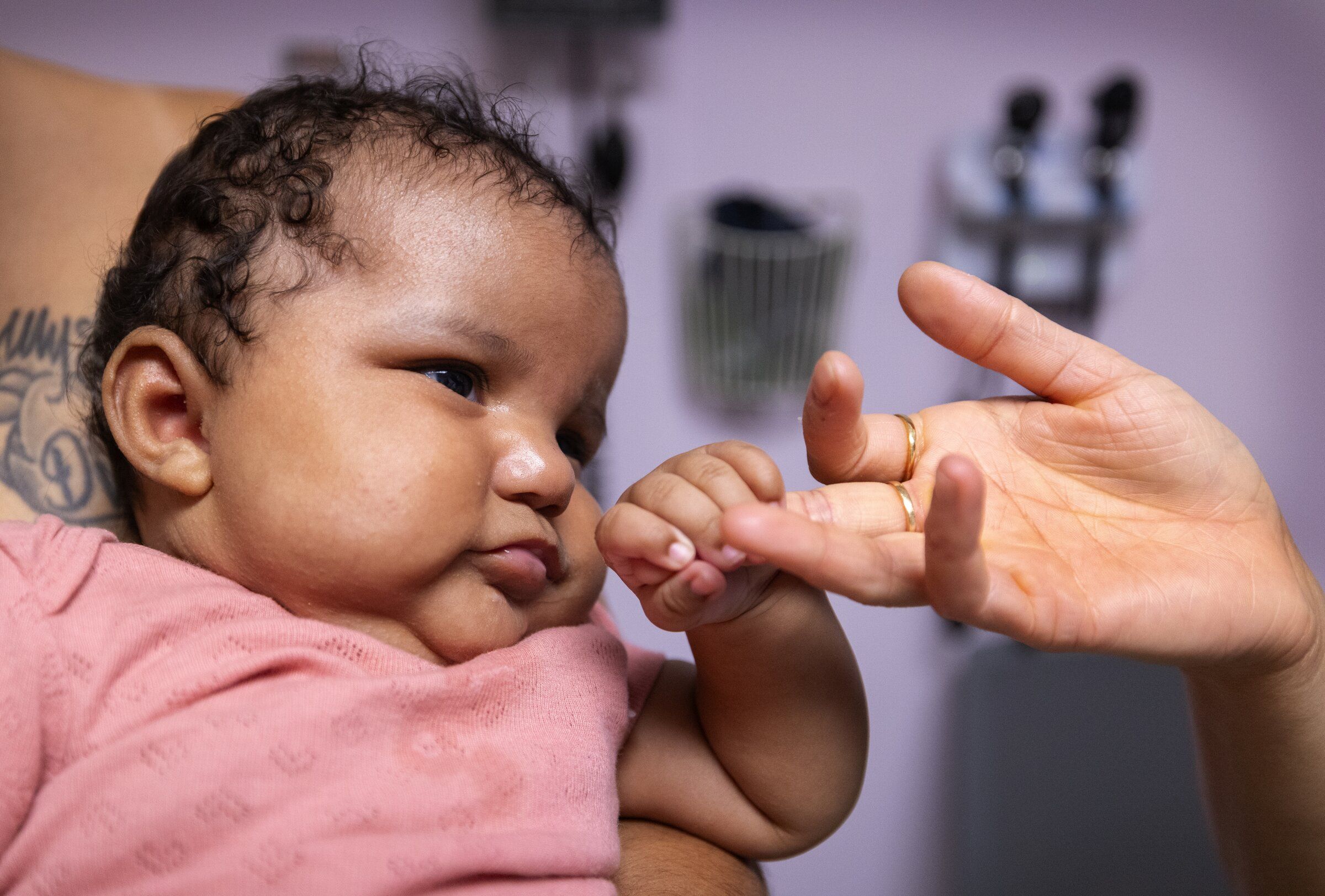 Naziyah and her mother, Reyna Berce, visit the Seattle Indian Health Board clinic in the Chinatown International District for an exam and immunization sign-up. (Ken Lambert / The Seattle Times)