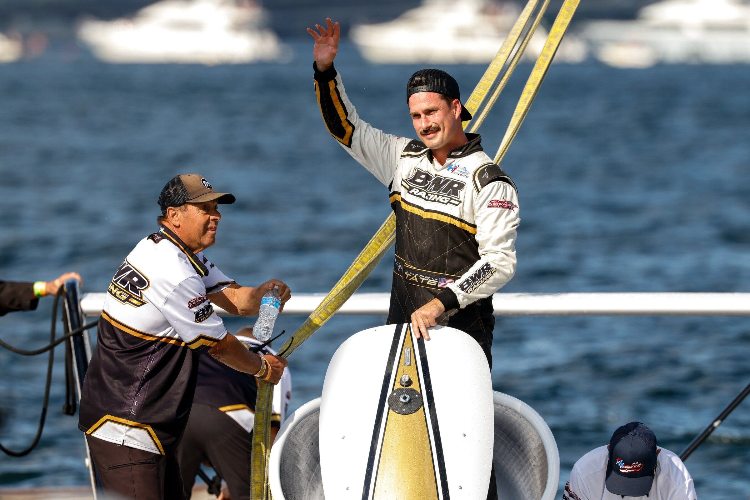 Andrew Tate in U-1 BWR Racing waves to onlookers in the pits after winning the Apollo Mechanical Cup on Lake Washington at Seafair. (Andrew Burke-Stevenson / The Seattle Times)