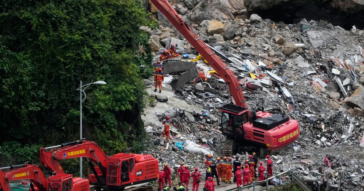 Rescuers race to find survivors in the rain after a landslide in China kills at least 8