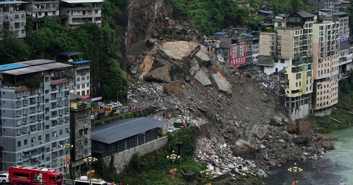 Rescuers race to find survivors in the rain after a landslide in China kills at least 8