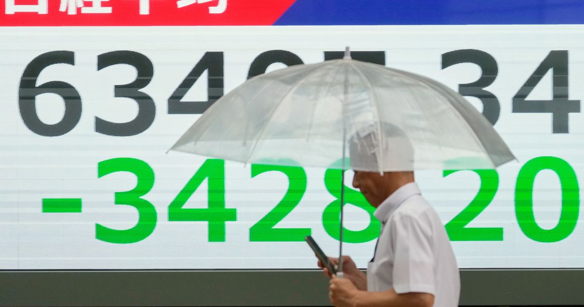 Asian shares sink, with Tokyo down nearly 5% as slumping AI stocks drag world markets lower