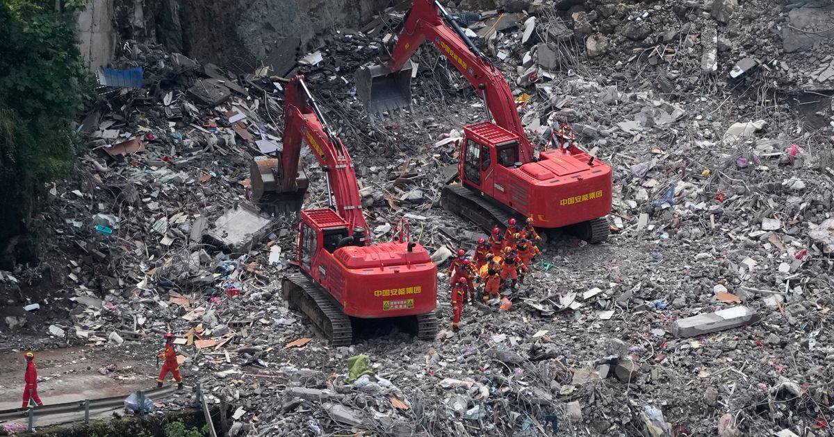 Rescuers in China search the rubble for survivors of landslide that killed 8 and left 34 missing