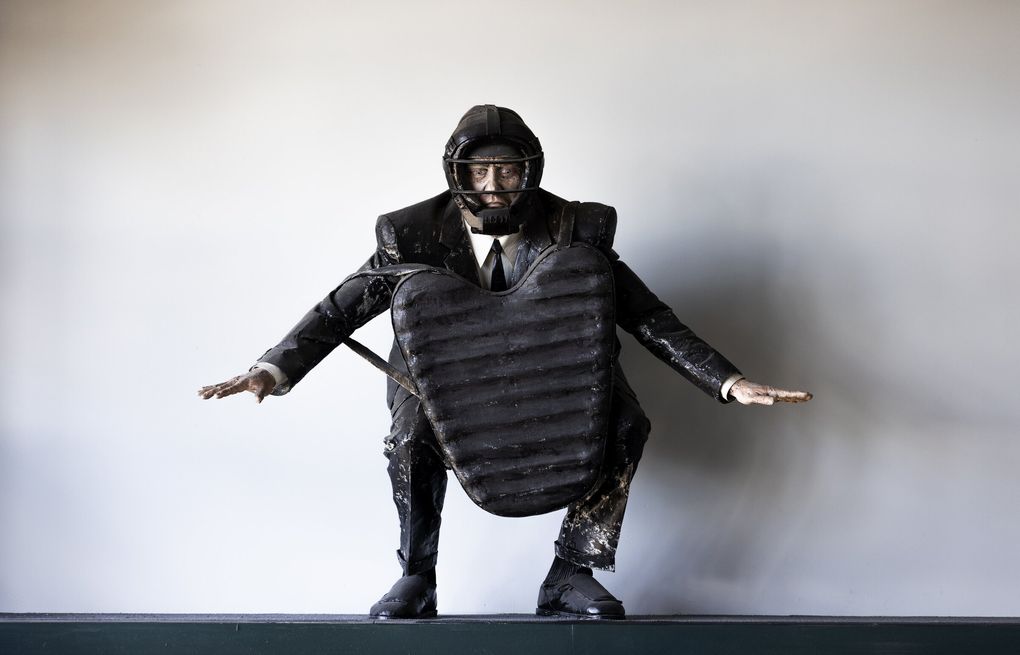 “Safe,” a sculpture by Scott Fife, can be found over the Terrace Club of the ballpark. The figure was inspired by Emmett Ashford, the first Black umpire in Major League Baseball. (Ken Lambert / The Seattle Times)