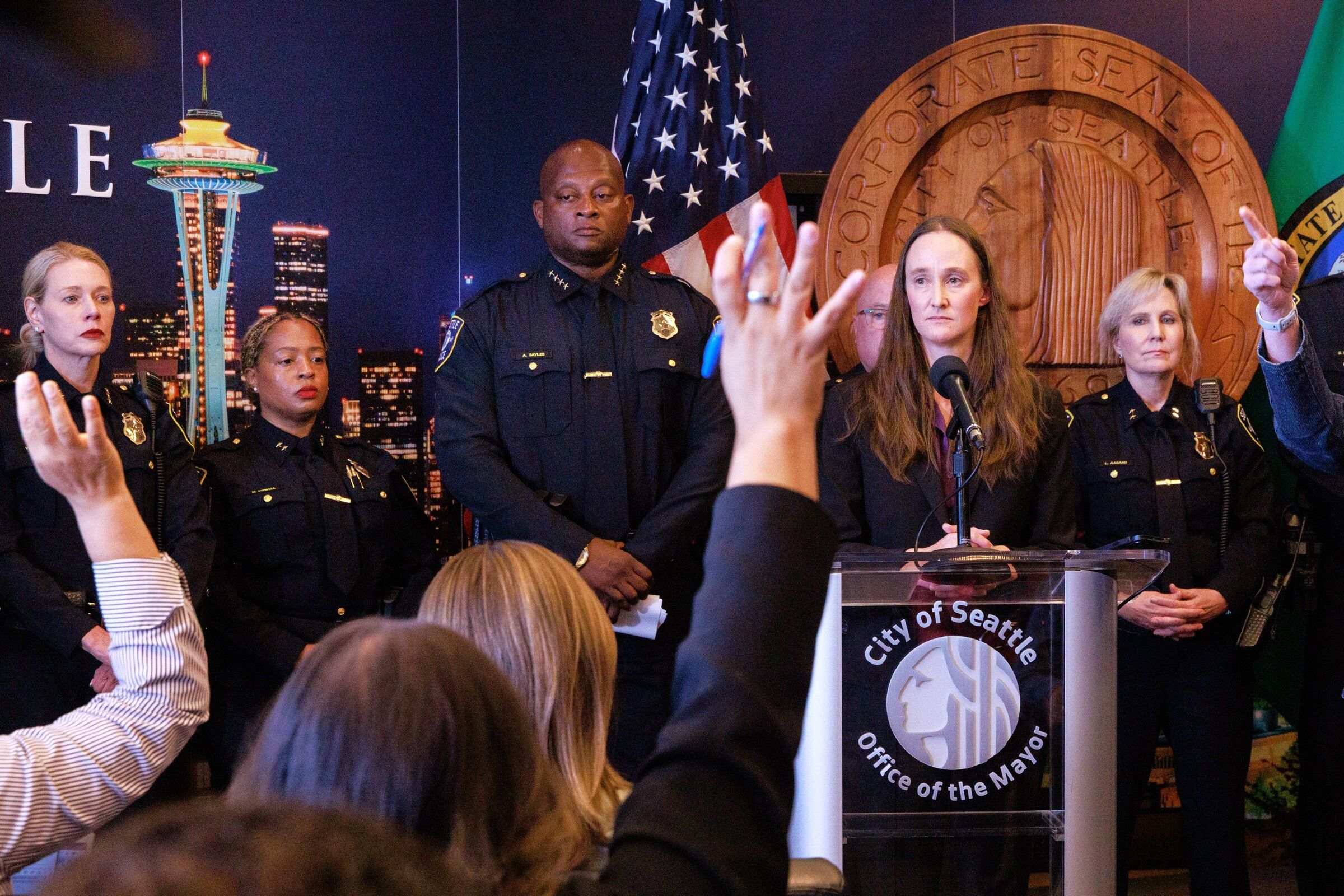Mayor Cathy Wilson answers questions from reporters during Friday’s press conference at Seattle City Hall about the appointment of Andre Sayles as acting police chief. (Erika Schultz / The Seattle Times)