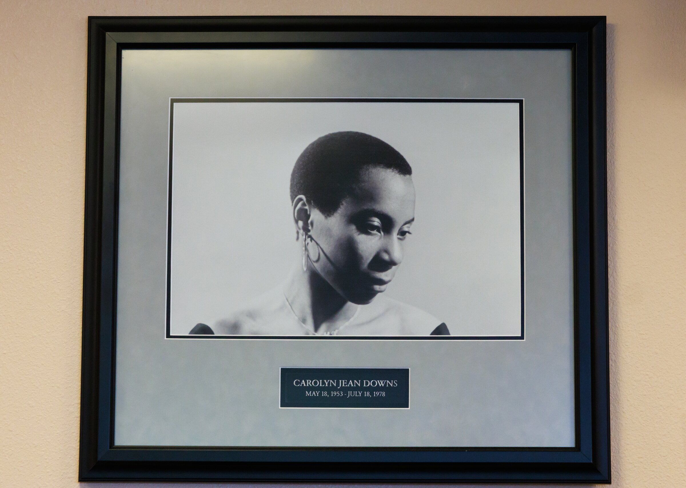 A portrait of Carolyn Jean Downs, a community activist and member of the Black Panther Party, at the Carolyn Downs Family Medical Center. Downs died of breast cancer at age 25 in 1978, and the clinic was named for her soon afterward. (Erika Schultz / The Seattle Times)