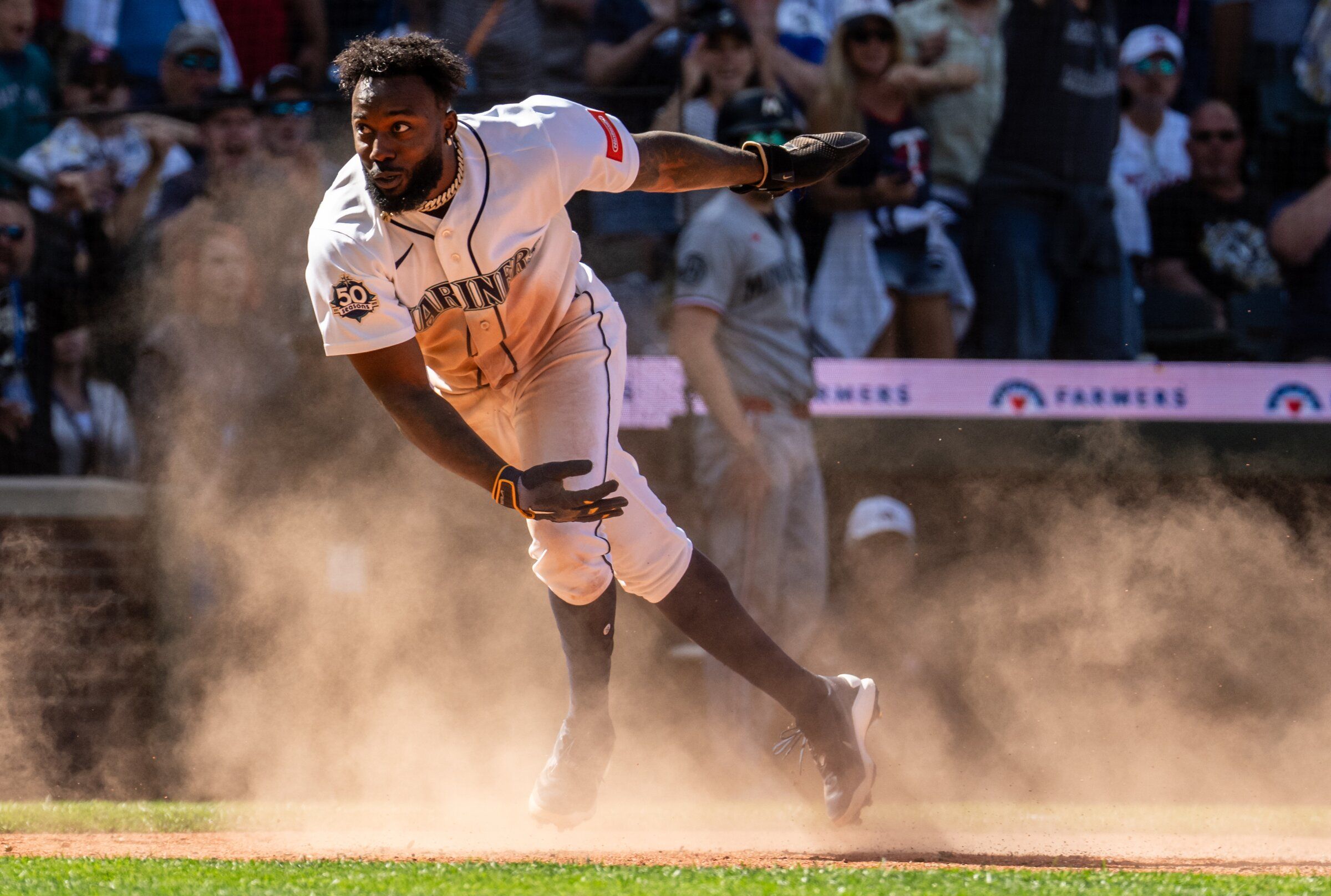 Seattle Mariners’ Randy Arozarena scores during the ninth inning of a baseball game against the Minnesota Twins, Saturday, Aug. 1, 2026, in Seattle. (Stephen Brashear / AP Photo/Stephen Brashear)
