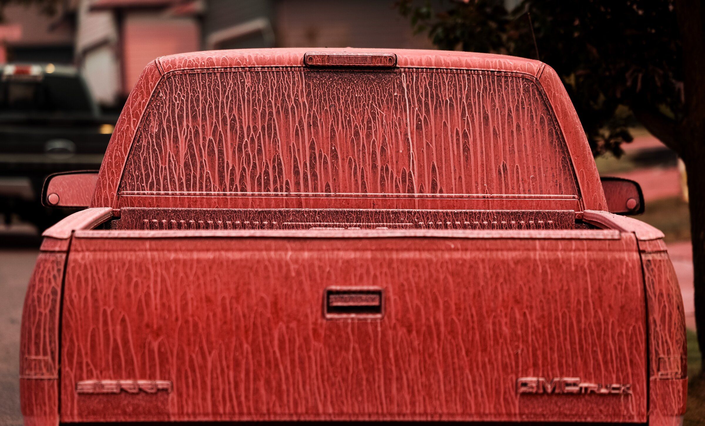 Fire retardant coats a pickup truck in the Indian Trail neighborhood on Sunday in Spokane. (Nick Wagner / The Seattle Times)