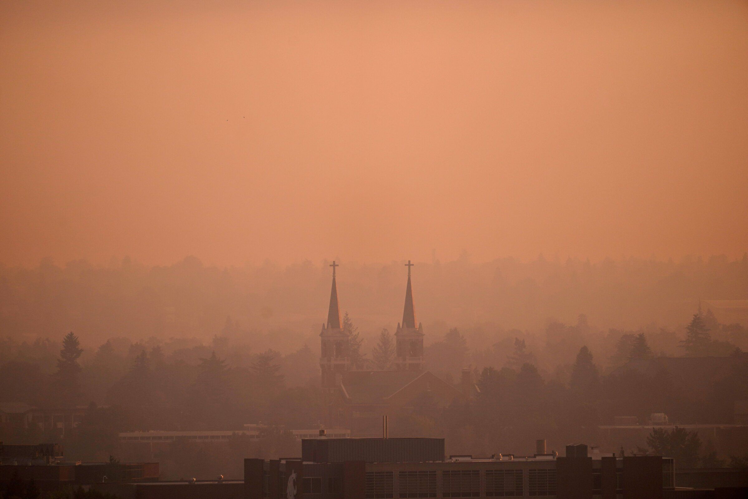 Wildfire smoke in the sky over Spokane as the Old Trails Fire burns nearby Monday. (David Ryder / Reuters)