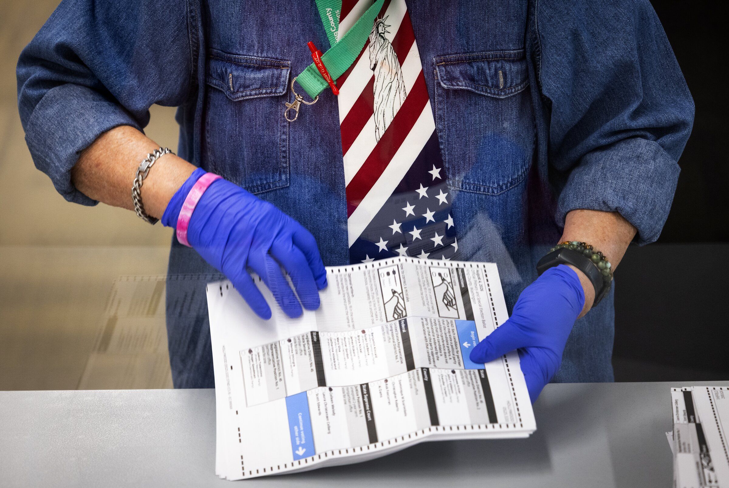 Ballots are processed at King County Elections headquarters on primary Election Day in Renton. (Ken Lambert / The Seattle Times)