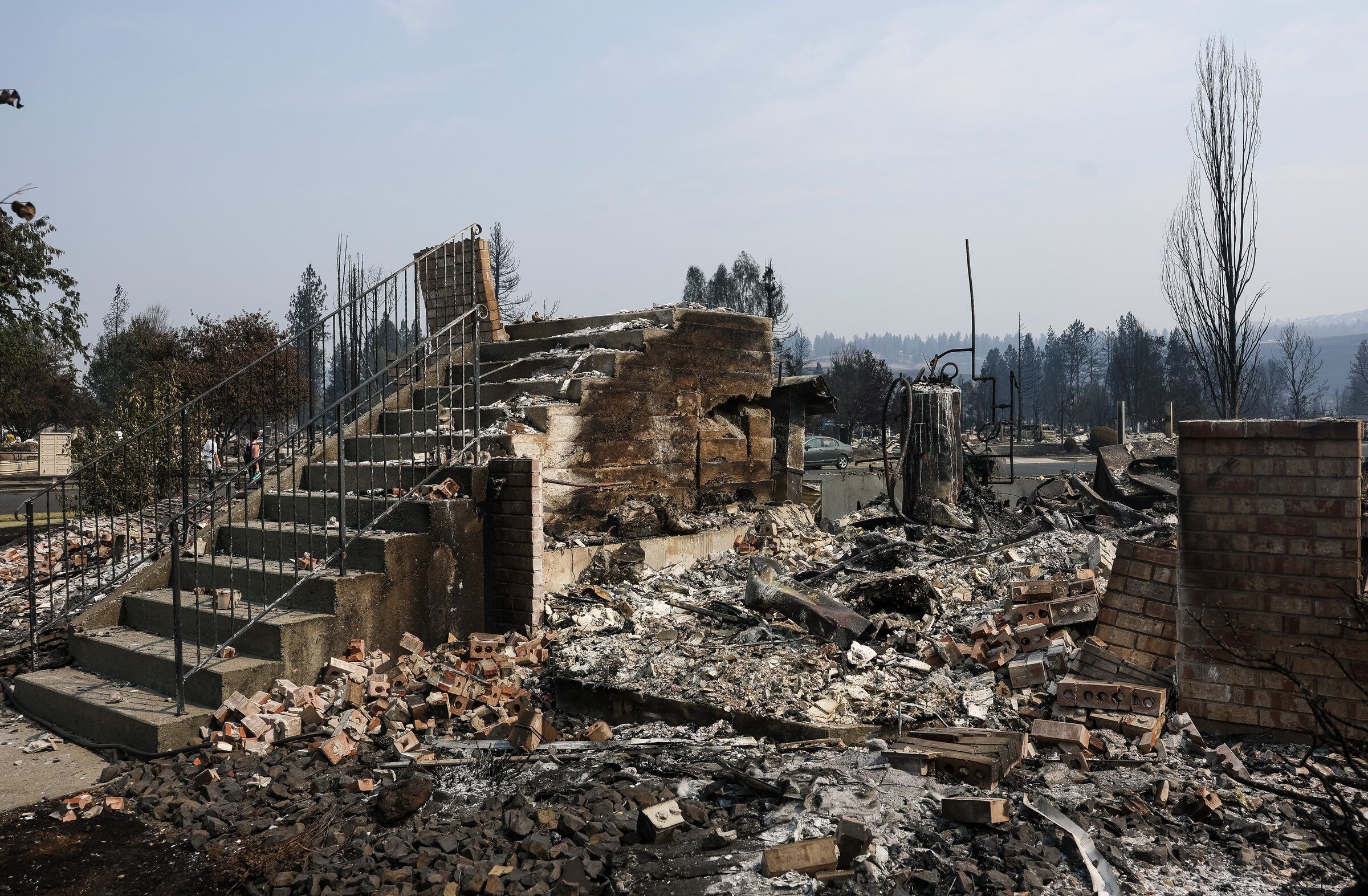 An entryway staircase leads to nowhere after the Old Trails fire burned through the Rifle Club neighborhood Aug. 4 in Spokane. (Nick Wagner / The Seattle Times)