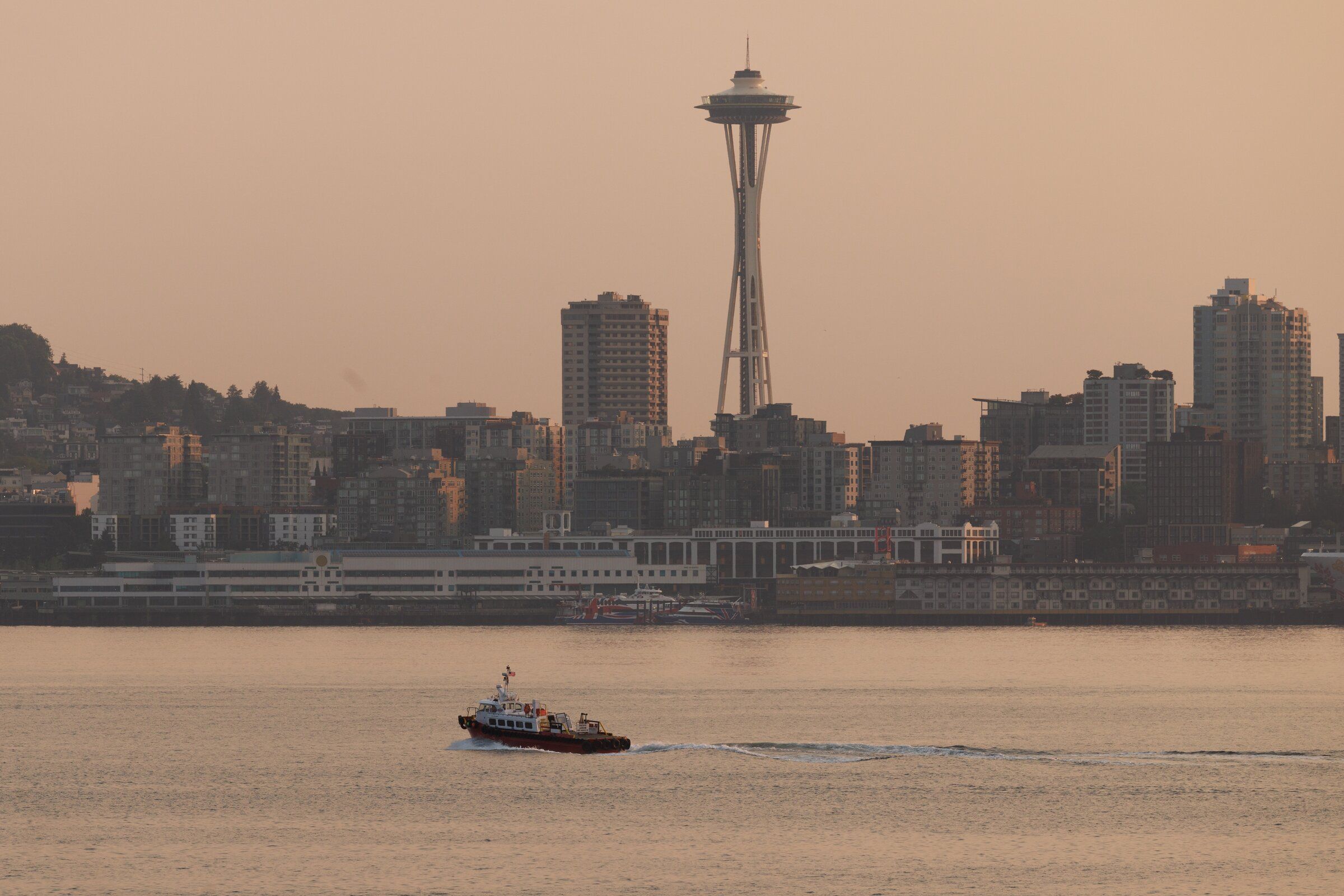 A haze of smoke from Eastern Washington wildfires is visible as vessel passes through Elliott Bay during the early morning hours in Seattle Wednesday, Aug. 5, 2026. (Erika Schultz / The Seattle Times)