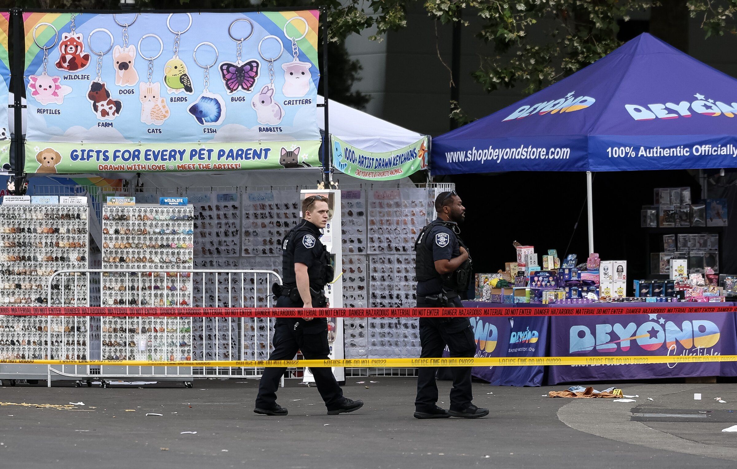 Seattle police officers work at the scene of a mass shooting at Seattle Center during the Bite of Seattle festival on July 26. (Nick Wagner / The Seattle Times)