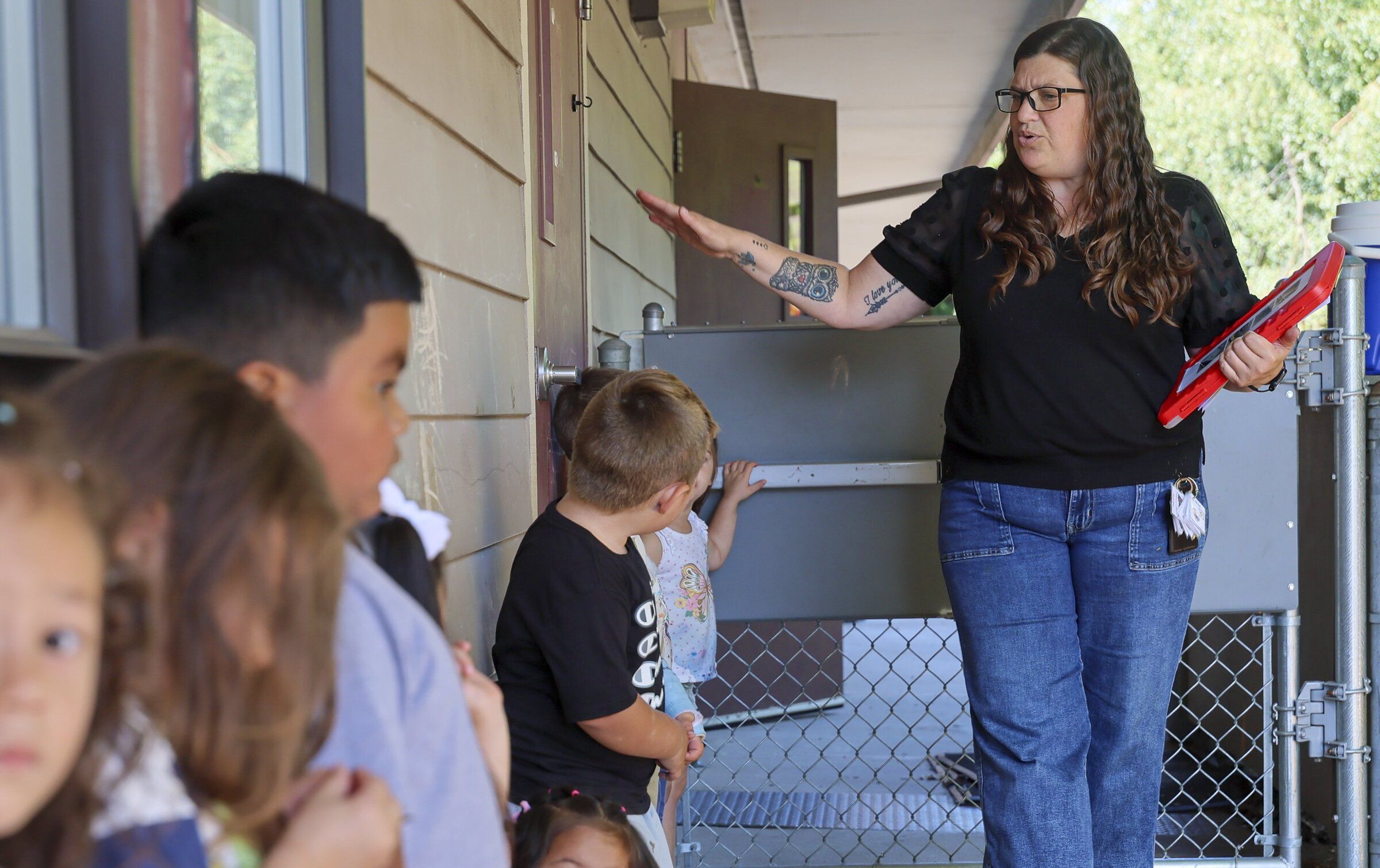 Treva Strahan takes attence at recess Wednesday morning at Head Start at Lower Columbia College in Longview, Washington, on August 20, 2025. (Kevin Clark / The Seattle Times)